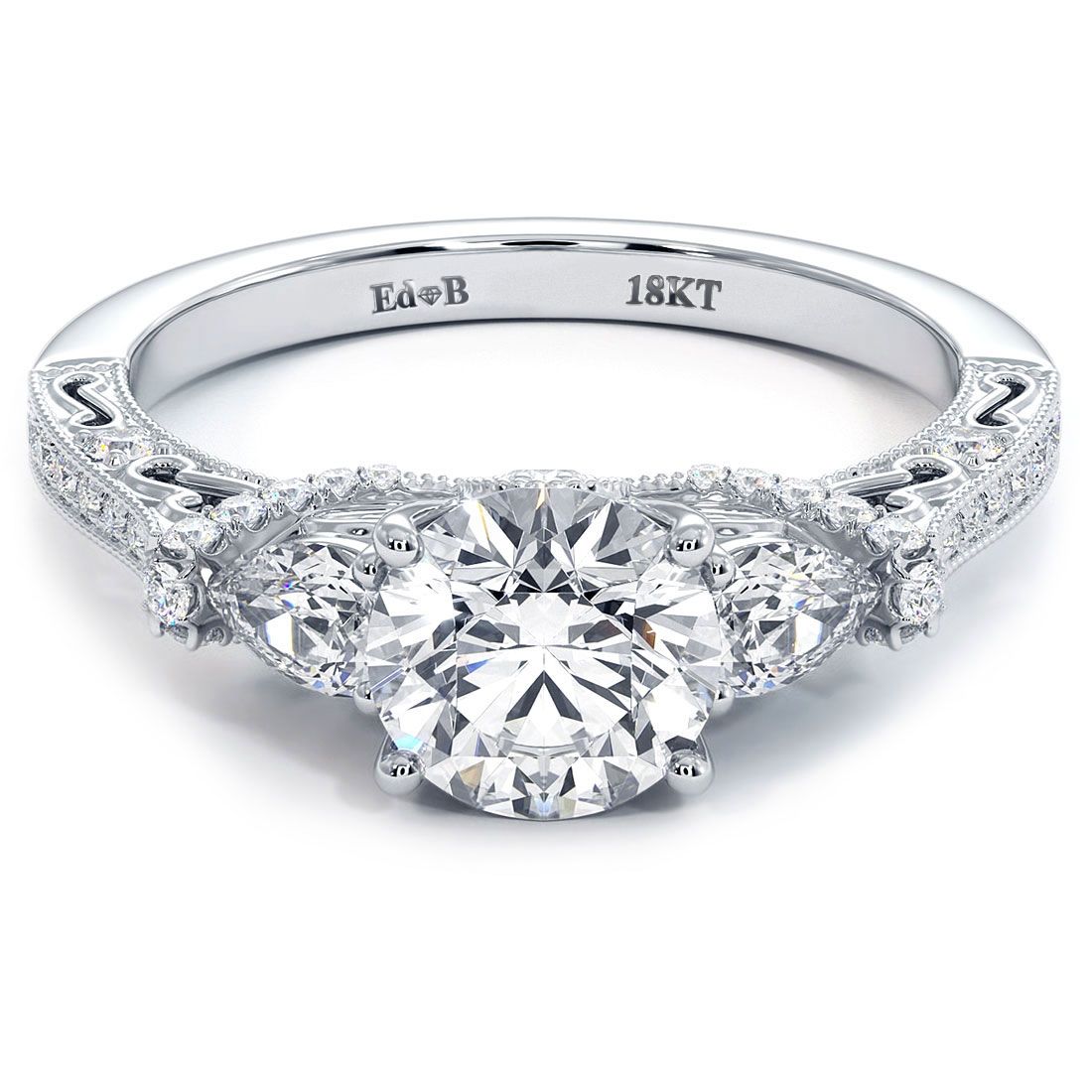 Vintage milgrain round diamond engagement ring with pear shape side stones in three-stone setting, 18KT white gold, shown in detailed studio shot. Custom bridal ring from Global Sky Diamonds, 44W 47th St Booth GF-10, Diamond District NYC. Round brilliant center diamond with pear side accents and pave shank. Website: globalskydiamond.com. Instagram @globalskydiamonds. TikTok @global.sky.diamonds. #Mazalito