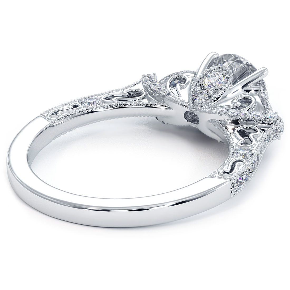 Underside view of ornate diamond engagement ring featuring round center diamond, pear side stones, and intricate filigree with milgrain accents in 18KT white gold. Luxury ring by Global Sky Diamonds, 44W 47th St Booth GF-10, NYC Diamond District. Designer bridal jewelry with vintage elegance. IG: @globalskydiamonds | TikTok: @global.sky.diamonds | Website: globalskydiamond.com | #Mazalito