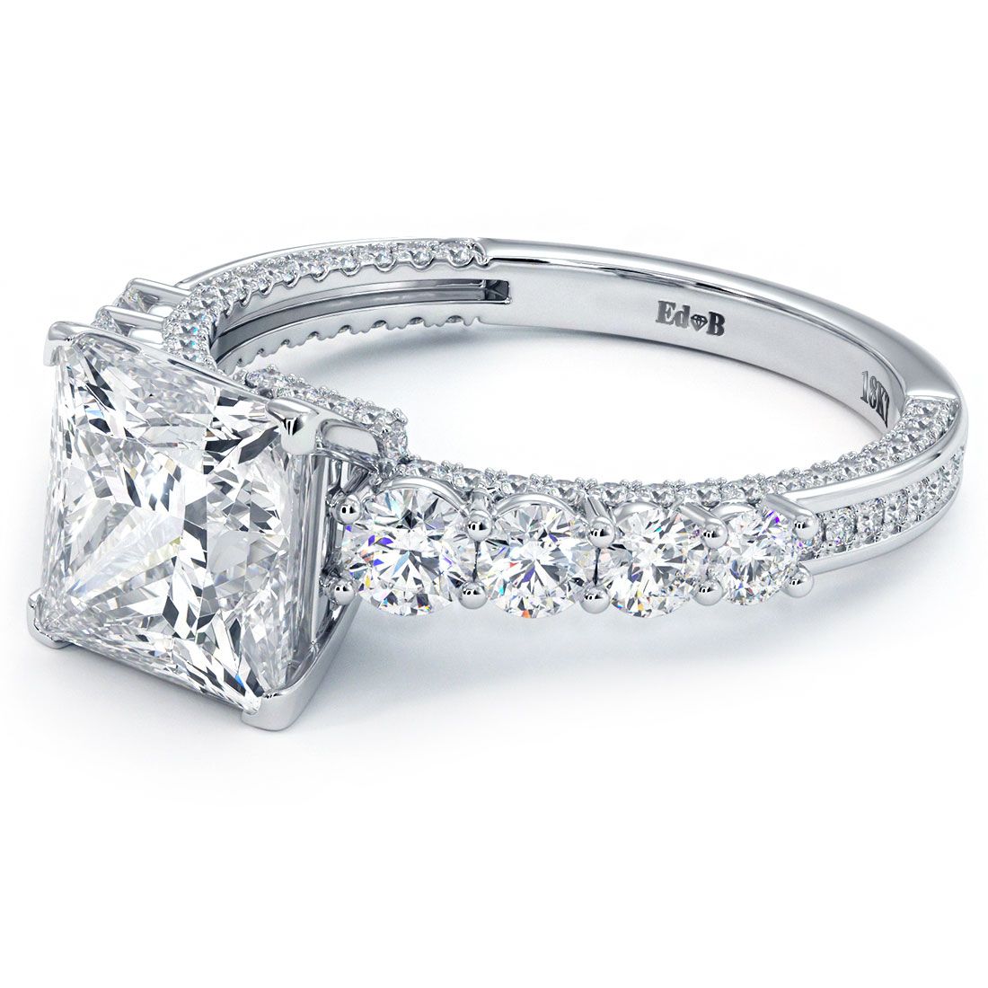 Angled close-up of Infinity Twist Round Halo diamond engagement ring setting, showcasing 0.77ctw side diamonds (G SI1) with elegant shank twist and micropavé detail in 18k white gold, for 1.0ct round center stone (not included), from Global Sky Diamonds, NYC Diamond District at 44W 47th St Booth GF-10. View at GlobalSkyDiamond.com.