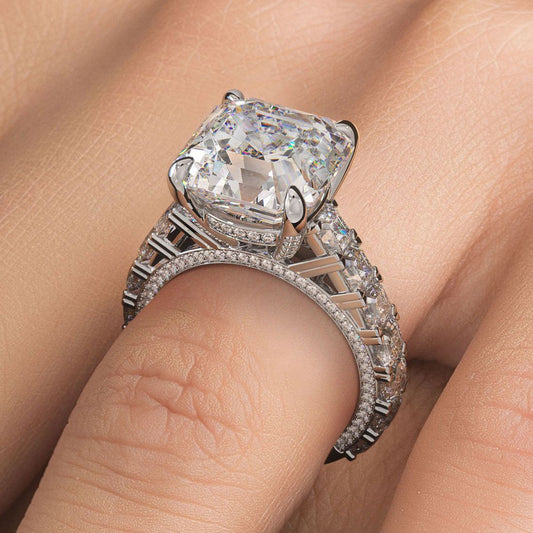 Elegant Asscher cut engagement ring setting shown on hand. Cathedral-set with micropavé band and elevated gallery for timeless sparkle. 18K white gold with 3.50 carats of G/SI1 side stones. Built for a 7.0ct Asscher center stone. From Global Sky Diamonds, NYC Diamond District, 44W 47th St GF-10. Shop now at globalskydiamond.com @globalskydiamonds @global.sky.diamond