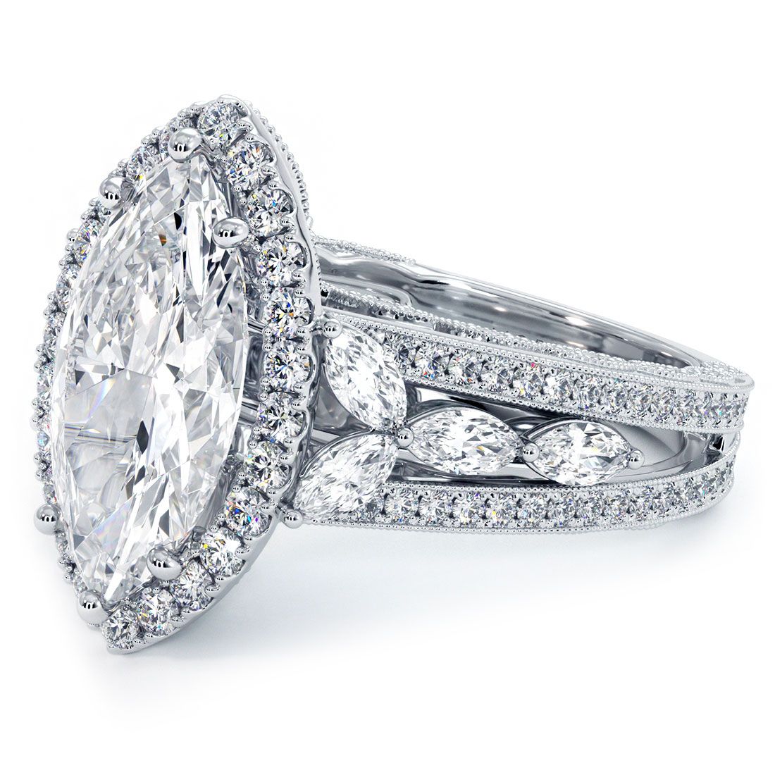 Close-up of marquise cut halo engagement ring with graduated micropavé diamond shank and vintage milgrain edge in white gold – crafted by Global Sky Diamonds – globalskydiamond.com
