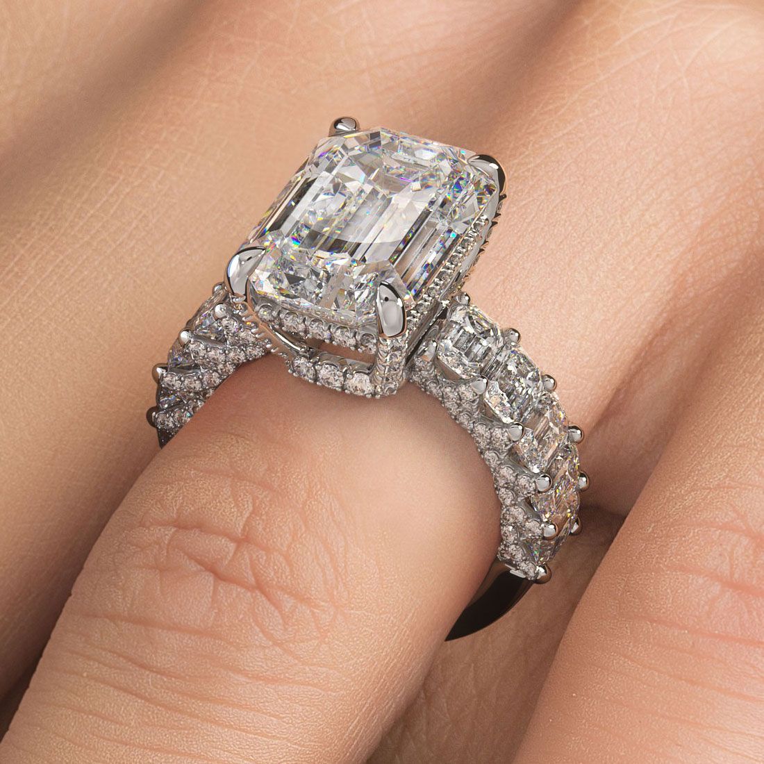 Stunning emerald cut diamond ring setting on hand, luxurious 18k white gold band with 5.12 carats of G/SI1 micropavé and graduated diamonds sparkling in natural light, photographed at Global Sky Diamond, 44 W 47th St Booth GF-10, Diamond District NYC — explore more at globalskydiamond.com.