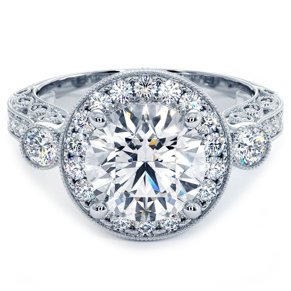 Front-facing view of vintage-inspired round halo diamond engagement ring setting in 18k white gold with 1.05 carats of G color SI1 clarity side diamonds and intricate filigree and milgrain detailing, designed to hold a 2.0ct round center diamond (not included), handcrafted by Global Sky Diamond at 44 W 47th St Booth GF-10 in New York City’s Diamond District — shop exclusive vintage engagement rings at globalskydiamond.com.