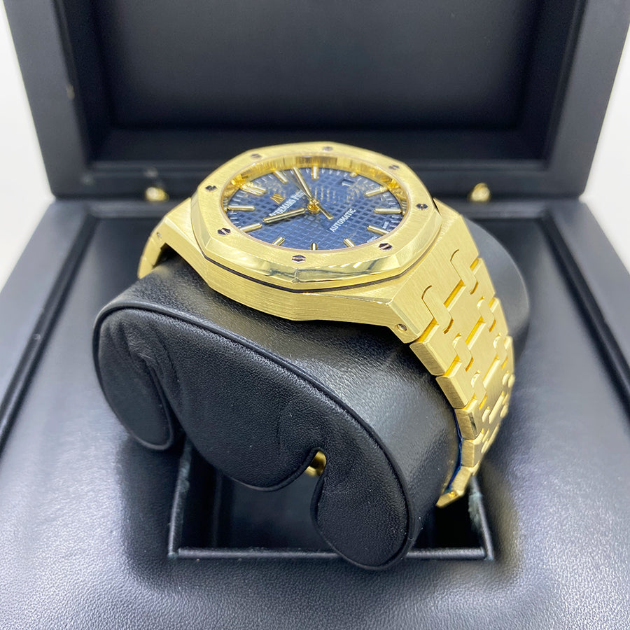 Angled shot of 18k yellow gold Audemars Piguet Royal Oak 15450BA with blue dial and classic bracelet design – full set luxury watch available at Global Sky Diamonds – globalskydiamond.com
