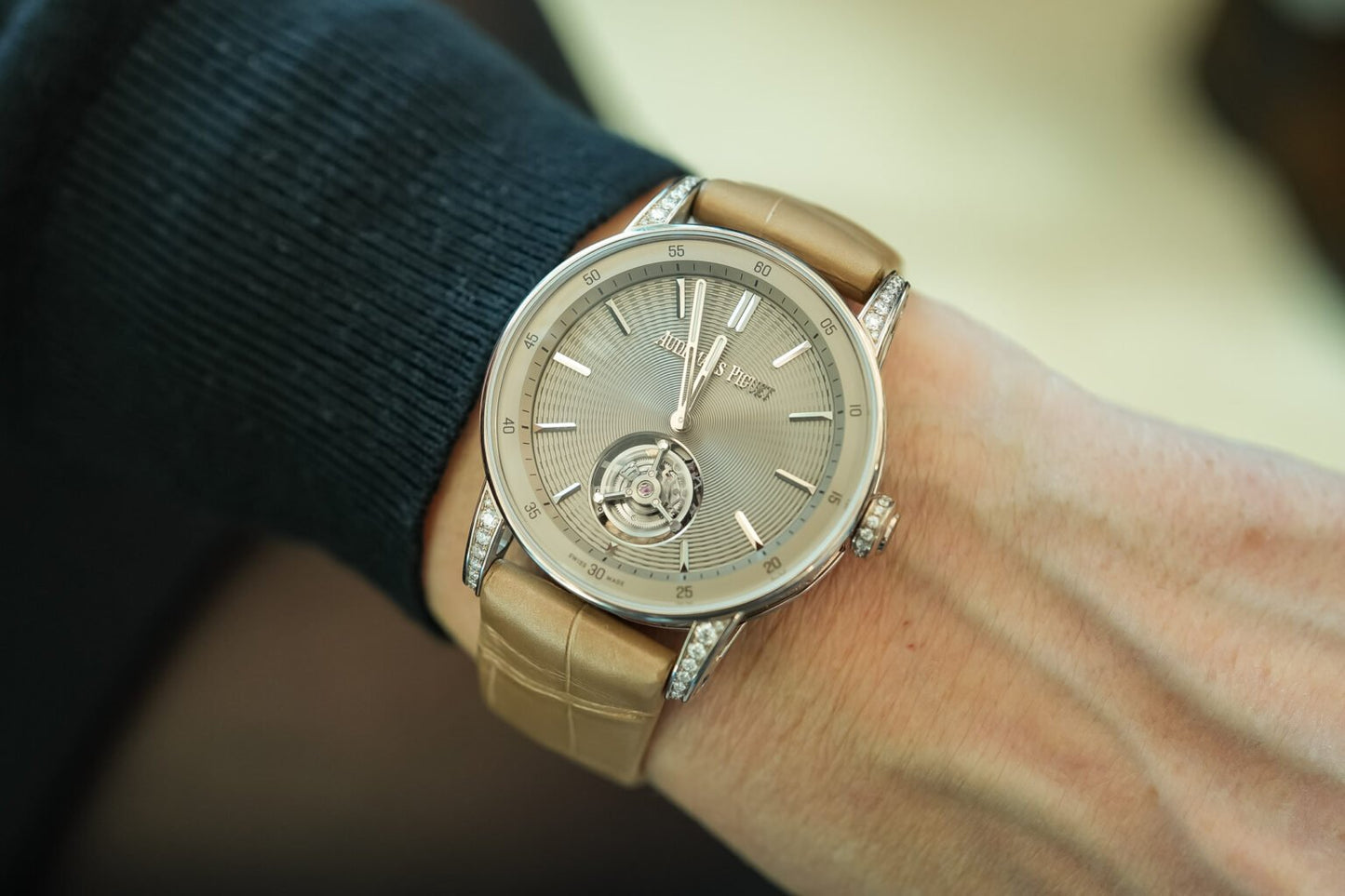 Angled shot of Audemars Piguet Code 11.59 38mm in sand gold on taupe leather strap – diamond bezel women’s AP full set available now – globalskydiamond.com