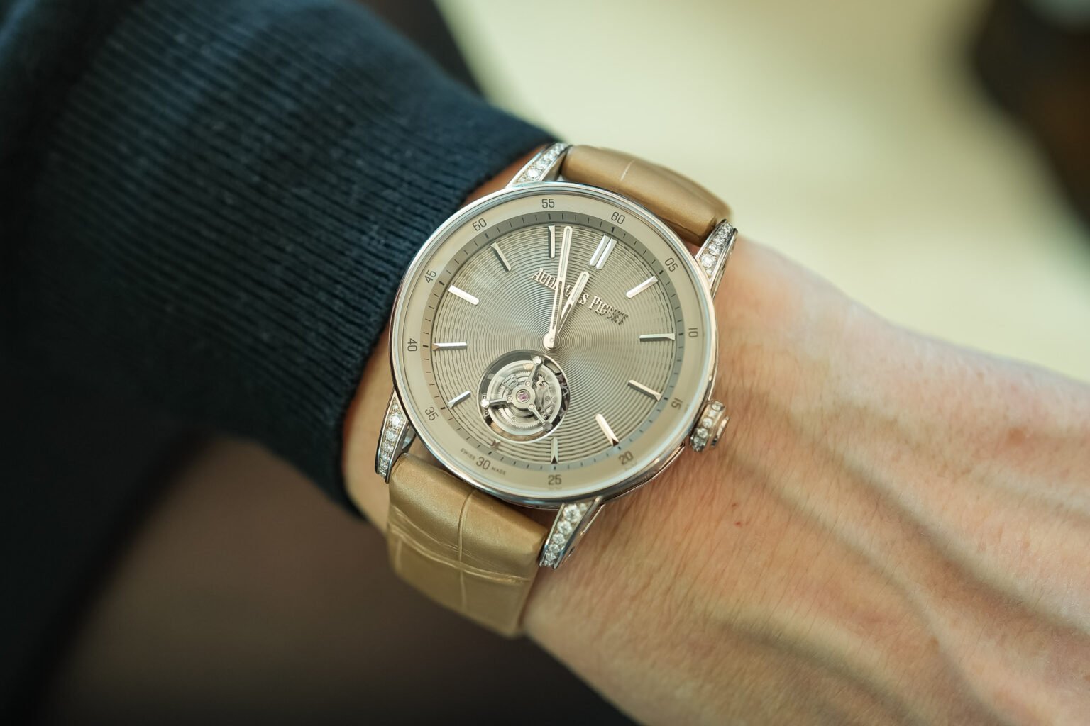 Angled shot of Audemars Piguet Code 11.59 38mm in sand gold on taupe leather strap – diamond bezel women’s AP full set available now – globalskydiamond.com