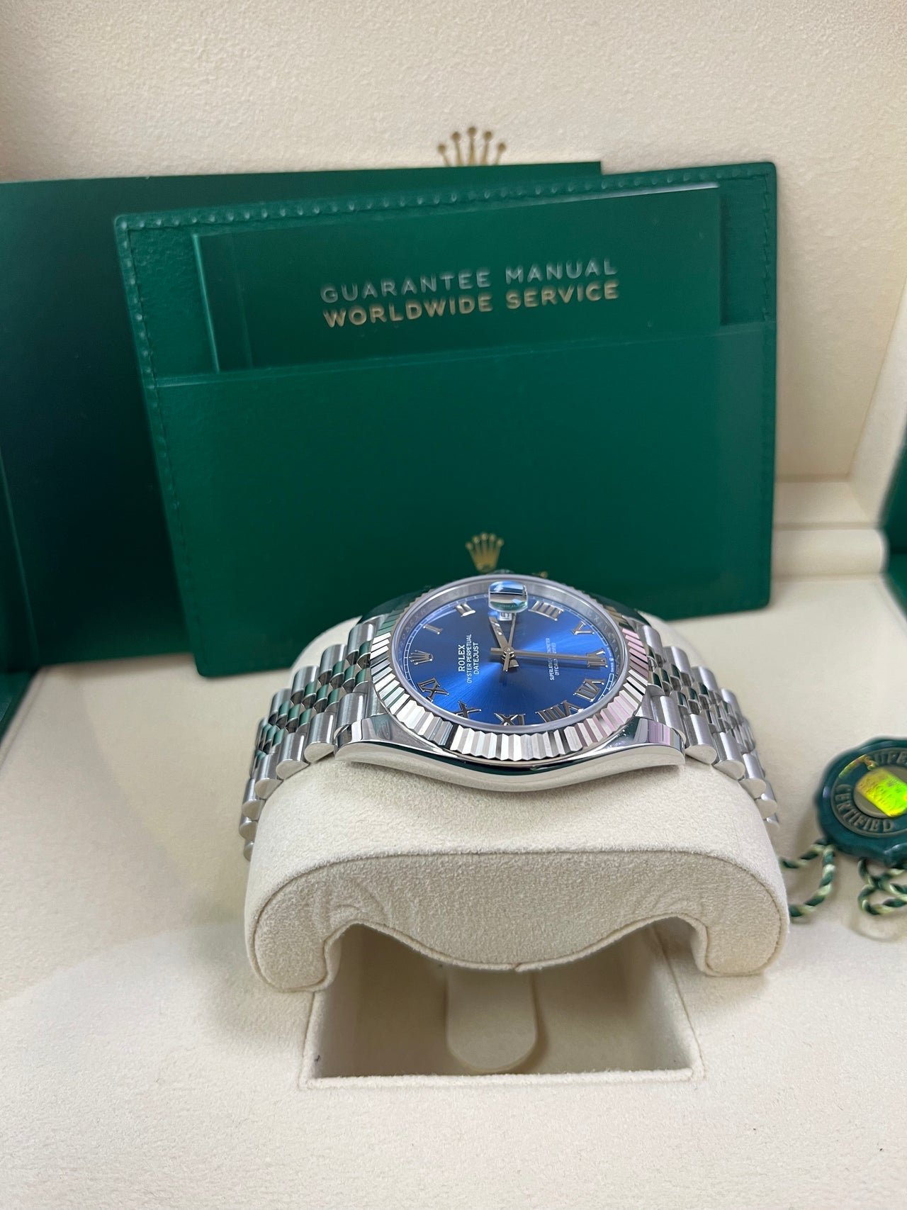 Side profile of Rolex Datejust 126334 with blue Roman dial, stainless steel case, and fluted bezel – pre-owned 2025 model in pristine condition from Global Sky Diamonds – Jubilee bracelet and Oyster clasp – globalskydiamond.com