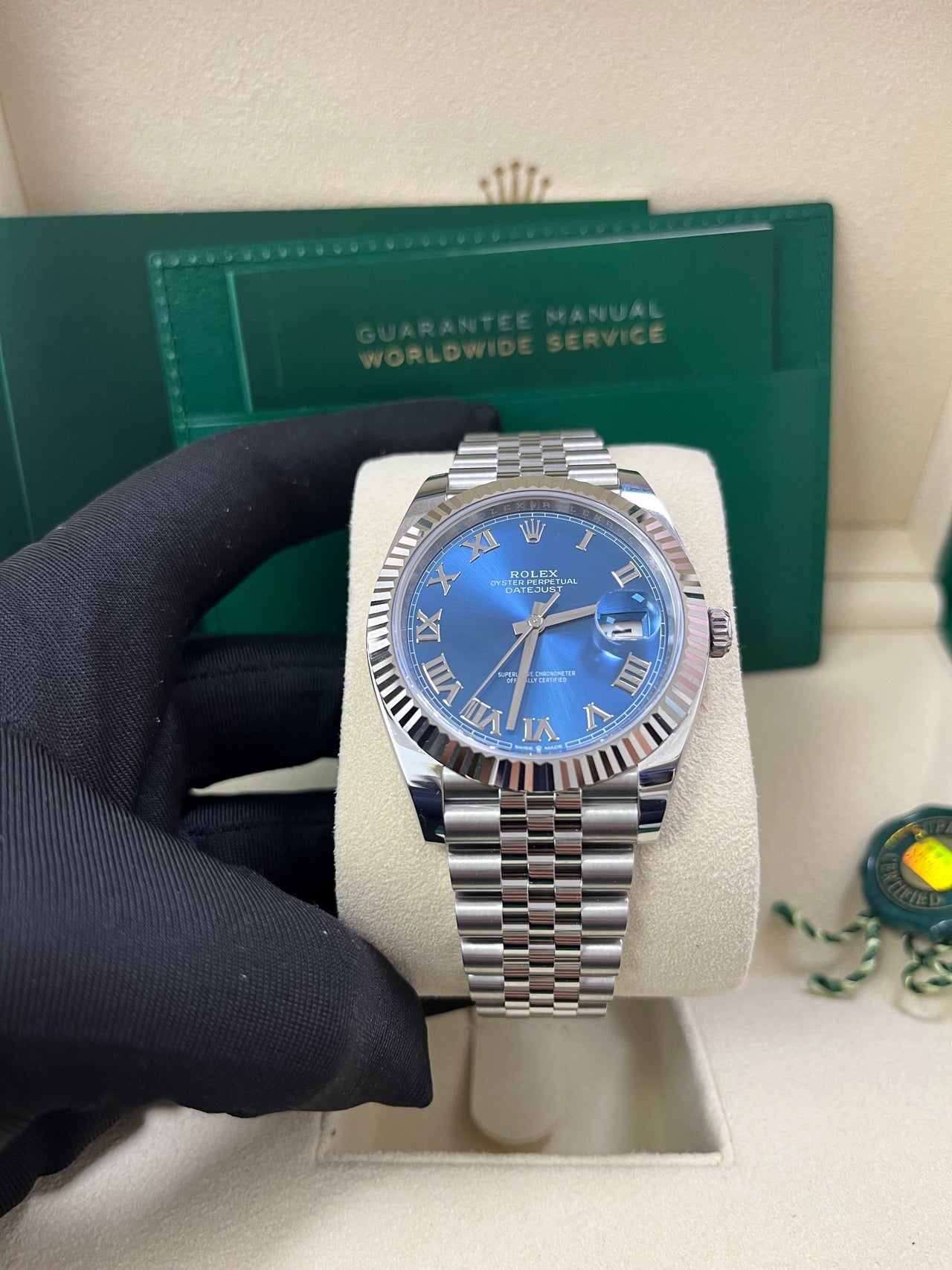 Close-up of Rolex Datejust 41mm blue sunray dial with Roman numeral markers and fluted bezel – pre-owned like-new Rolex model 126334 – available at Global Sky Diamonds – globalskydiamond.com