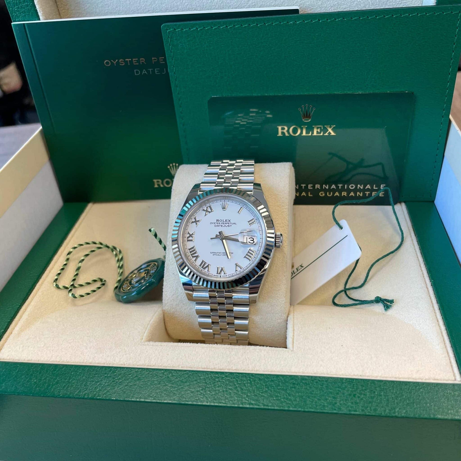 Full set of pre-owned Rolex Datejust 126334 – includes Rolex box, warranty card, booklet, and Certificate of Authenticity – like-new white Roman dial 2025 model available at Global Sky Diamonds – globalskydiamond.com