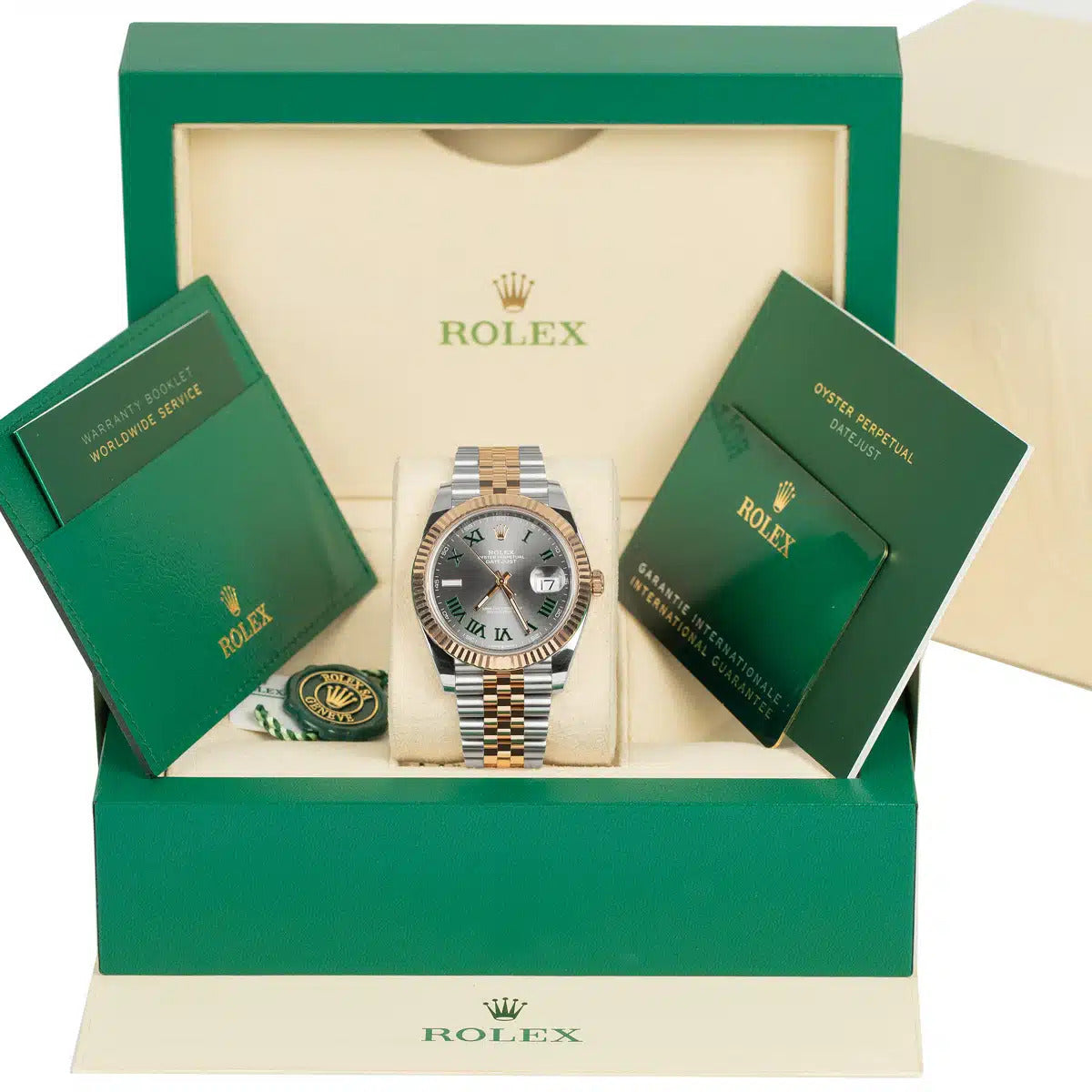 Display of full Rolex Datejust 126331 set with box, card, booklet, and Wimbledon dial – pre-owned Rolex in like-new condition from Global Sky Diamonds in the NYC Diamond District – globalskydiamond.com
