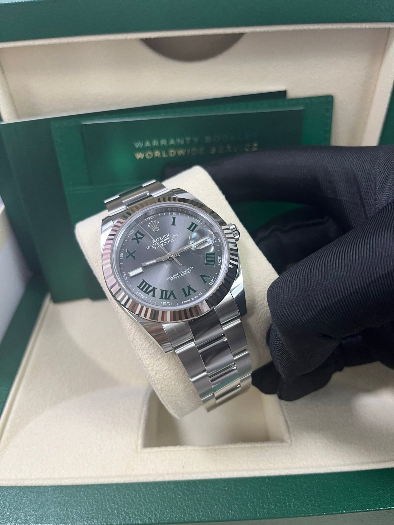 Angled shot of Rolex Datejust 41mm grey dial with Oyster bracelet and Oyster clasp – stainless steel and white gold Rolex 126334 pre-owned like new for $13,000 – Global Sky Diamonds – globalskydiamond.com
