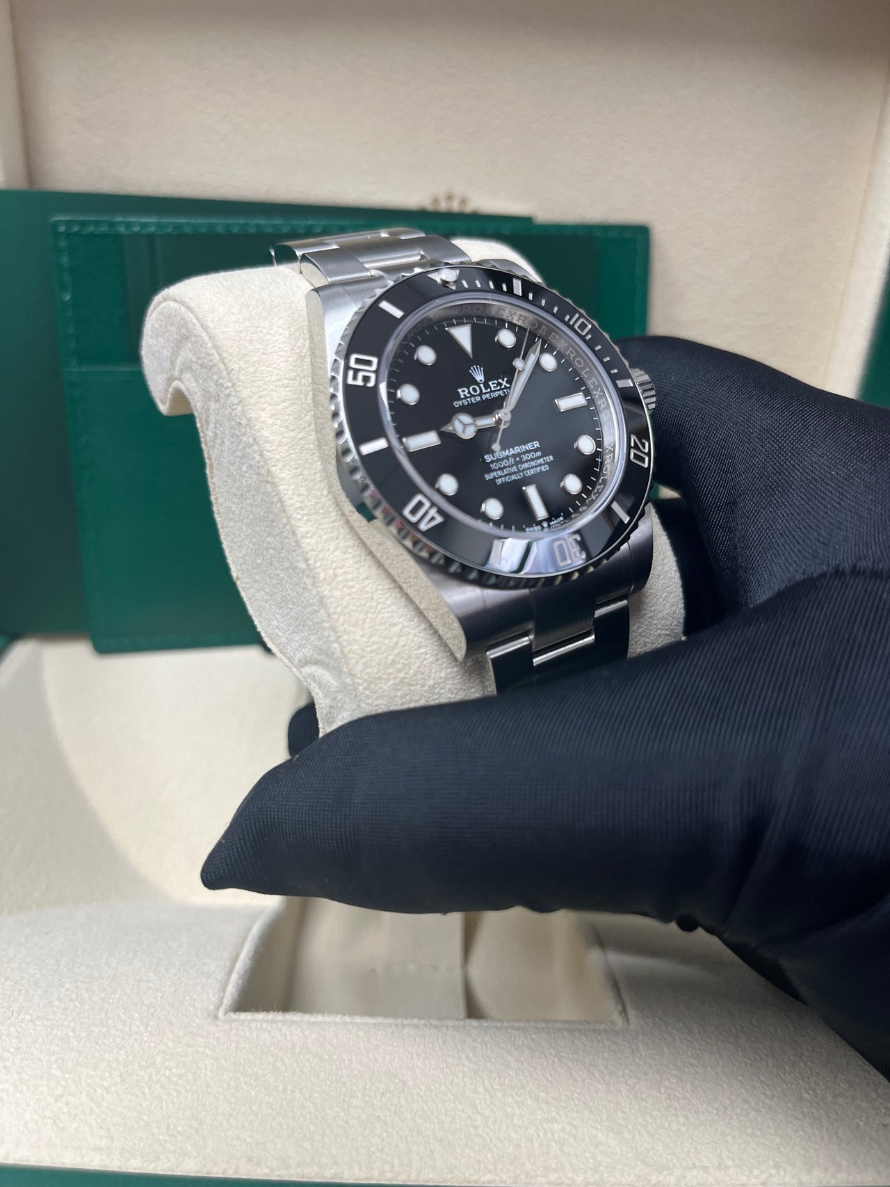 Angled shot of Rolex Submariner 124060 with black Cerachrom bezel, clean no-date black dial, and steel bracelet – pre-owned Rolex 2025 watch from Global Sky Diamonds – globalskydiamond.com