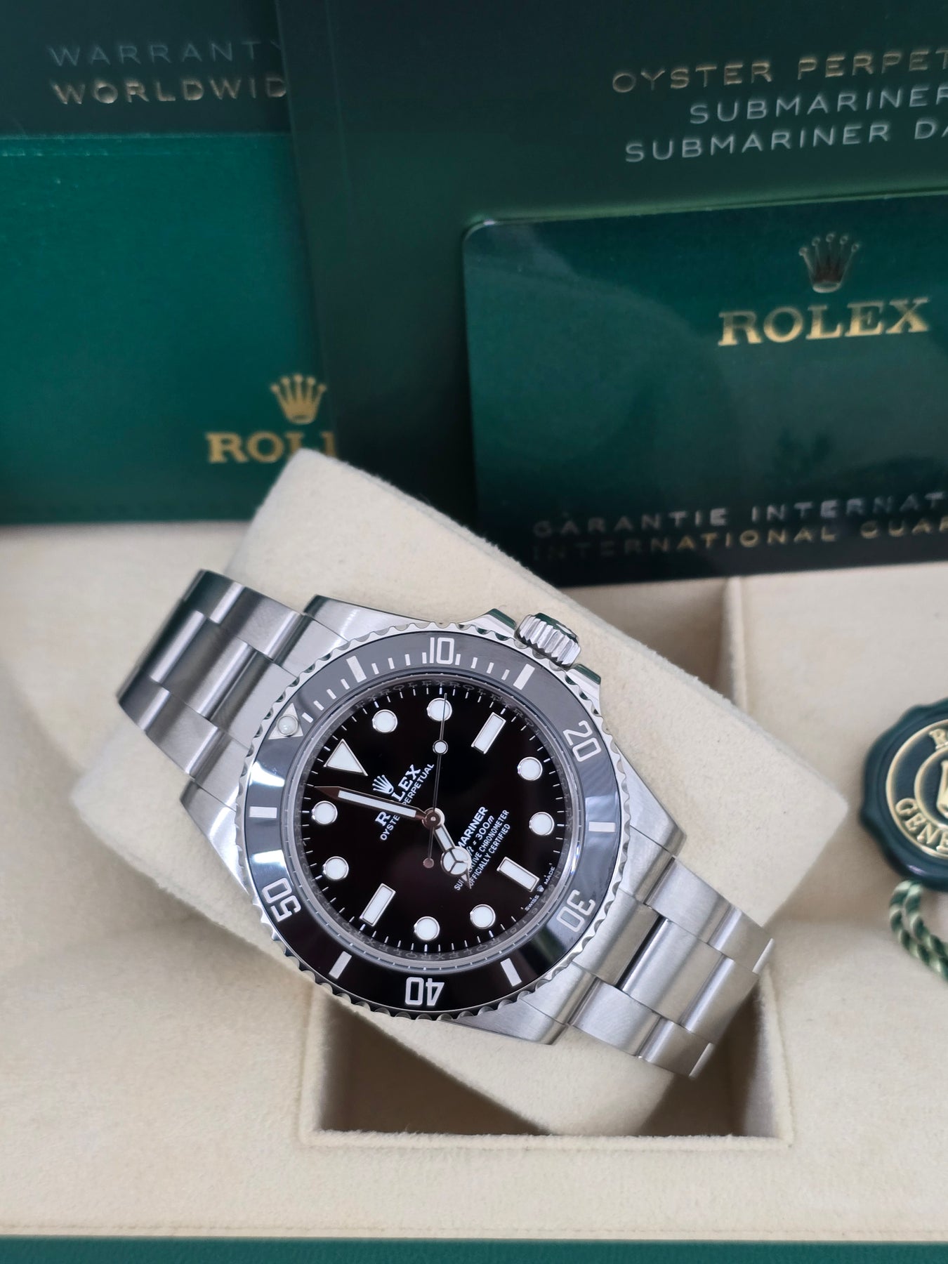 Angled image of Rolex Submariner 40mm 114060 with black Cerachrom bezel, Oyster bracelet, and Triplock crown – 2018 pre-owned full set Rolex for $10,500 – globalskydiamond.com