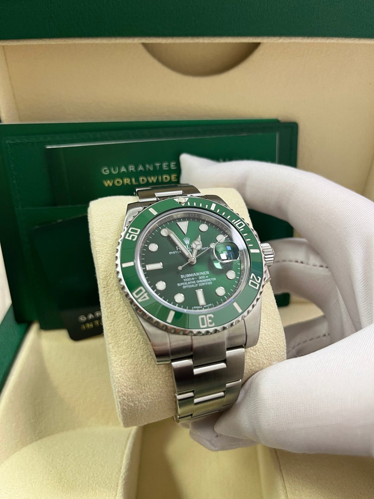 Angled shot of Rolex Submariner 40mm Hulk model 116610LV with stainless steel case, Glidelock clasp, and green dial – pre-owned 2018 full set for $18,500 at Global Sky Diamonds – globalskydiamond.com