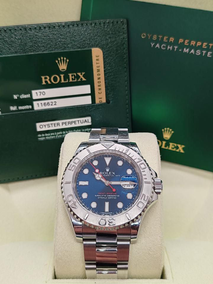 Rolex Yacht-Master 40mm Blue Dial Men's Watch 116622 with stainless steel Oyster case and bracelet, bidirectional platinum bezel, luminous hands, dot hour markers, sapphire crystal, automatic movement, date window at 3 o’clock, and Oysterlock clasp—never worn, 100% authentic with Rolex box and warranty card, available now at Global Sky Diamonds in New York City’s Diamond District at 44 W 47th St Booth GF-10. Includes 3-year warranty and fast delivery. Shop luxury watches at globalskydiamond.com.
