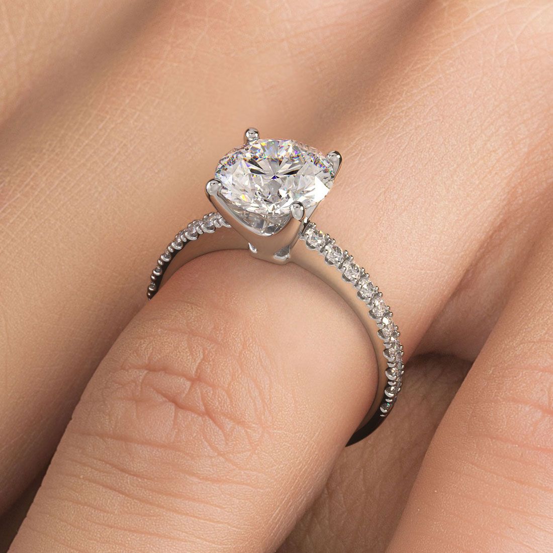 Elegant 18k white gold round brilliant diamond engagement ring worn on hand, 0.42ctw micro prong setting from Global Sky Diamonds, located in Diamond District NYC, 44W 47th St GF-10, follow @globalskydiamonds on Instagram, @global.sky.diamond TikTok