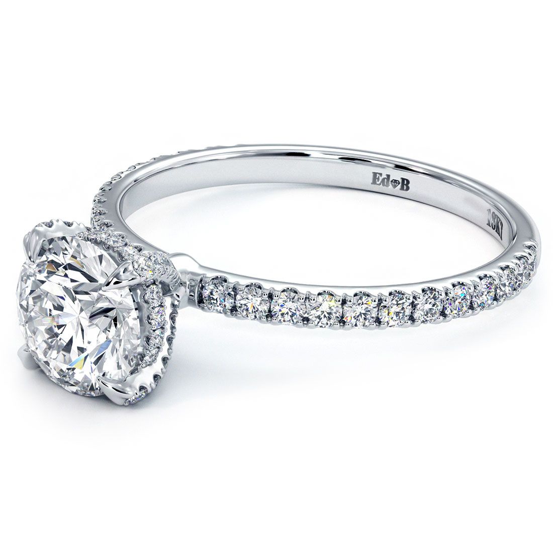 Angled view of round hidden halo diamond engagement ring setting with brilliant basket head, eagle prongs, and petite micropavé band (0.36ctw) in 18k white gold | Signature sparkle from Global Sky Diamonds – Mazalito design in the heart of NYC’s Diamond District | globalskydiamond.com