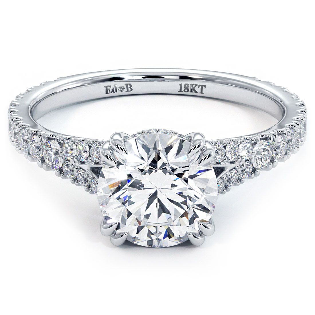 Front view of Round Brilliant Infinity Twist Round Halo Micropavé Diamond Engagement Ring Setting in 18k white gold, showcasing pavé-set G color SI1 clarity diamonds, diamond-encrusted band, and claw prong detail, sold by Global Sky Diamonds in NYC’s Diamond District, 44W 47th St Booth GF-10. Shop at globalskydiamond.com – luxury engagement rings with expert craftsmanship.