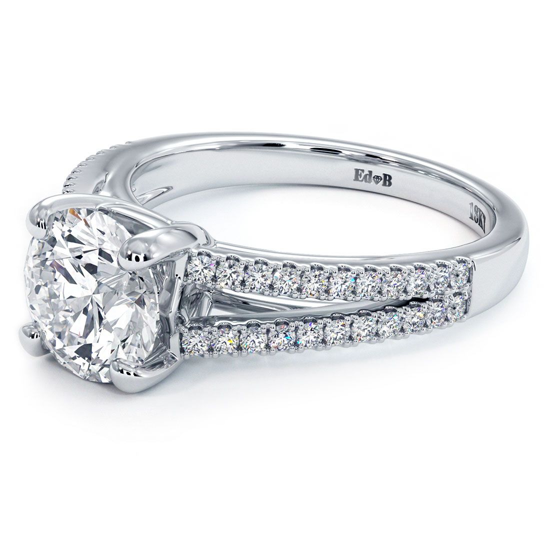 Angled view of micro-prong split shank round brilliant diamond engagement ring setting in 18k white gold with 0.31ctw of G/SI1 side diamonds. Designed for a 1.50ct round center stone. Elegant and modern split design offers brilliance from every angle. Crafted by Global Sky Diamonds, 44W 47th St Booth GF-10, NYC Diamond District. Shop online at globalskydiamond.com.