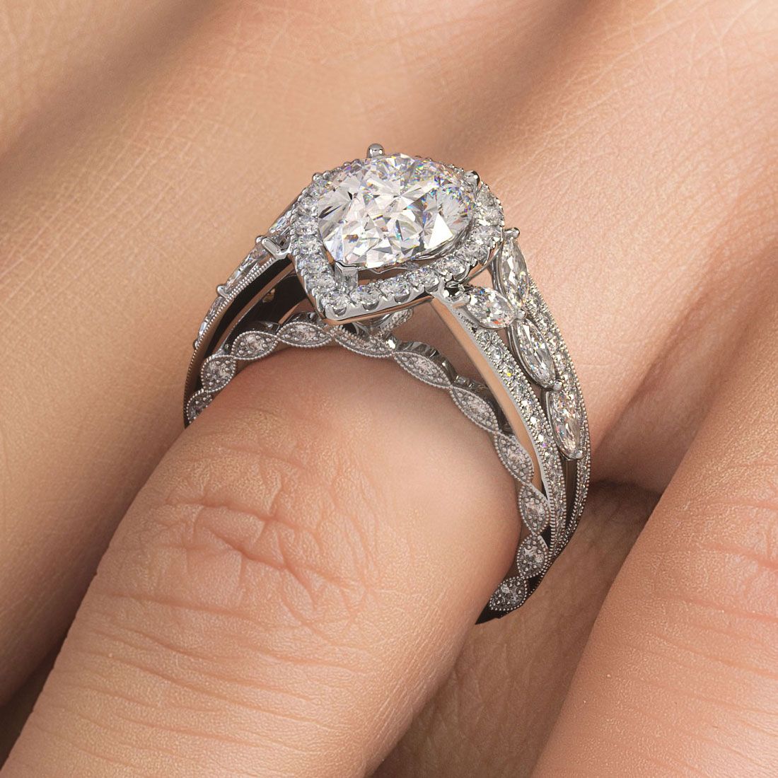 Close-up of vintage-style pear-shaped diamond halo ring setting with micropavé graduated shank in white gold, created in NYC’s Diamond District by Global Sky Diamonds — globalskydiamond.com