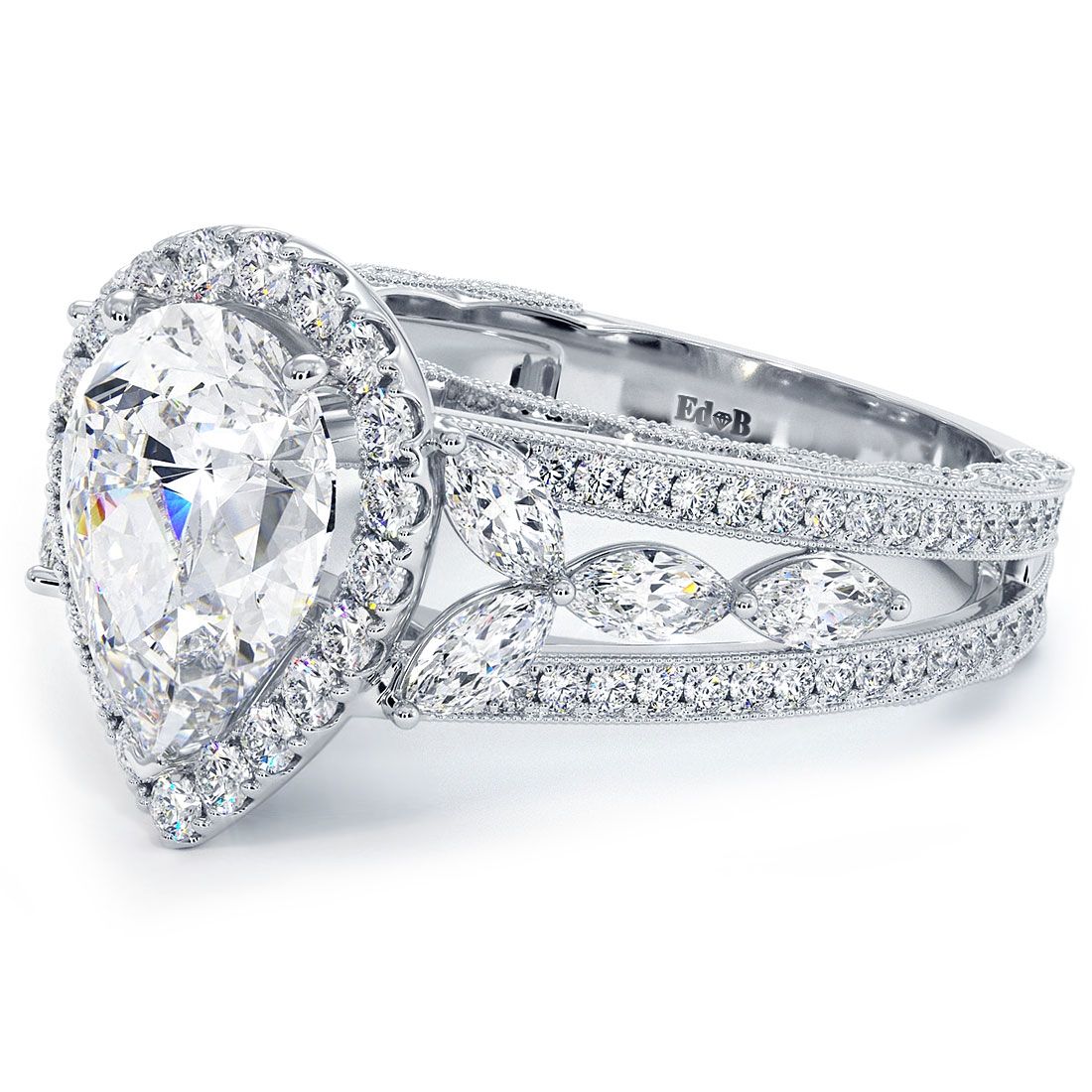 Angled view of pear-shaped halo engagement ring setting in 18k white gold with elegant vintage micropavé shank, G color SI1 clarity diamonds from Global Sky Diamonds — globalskydiamond.com