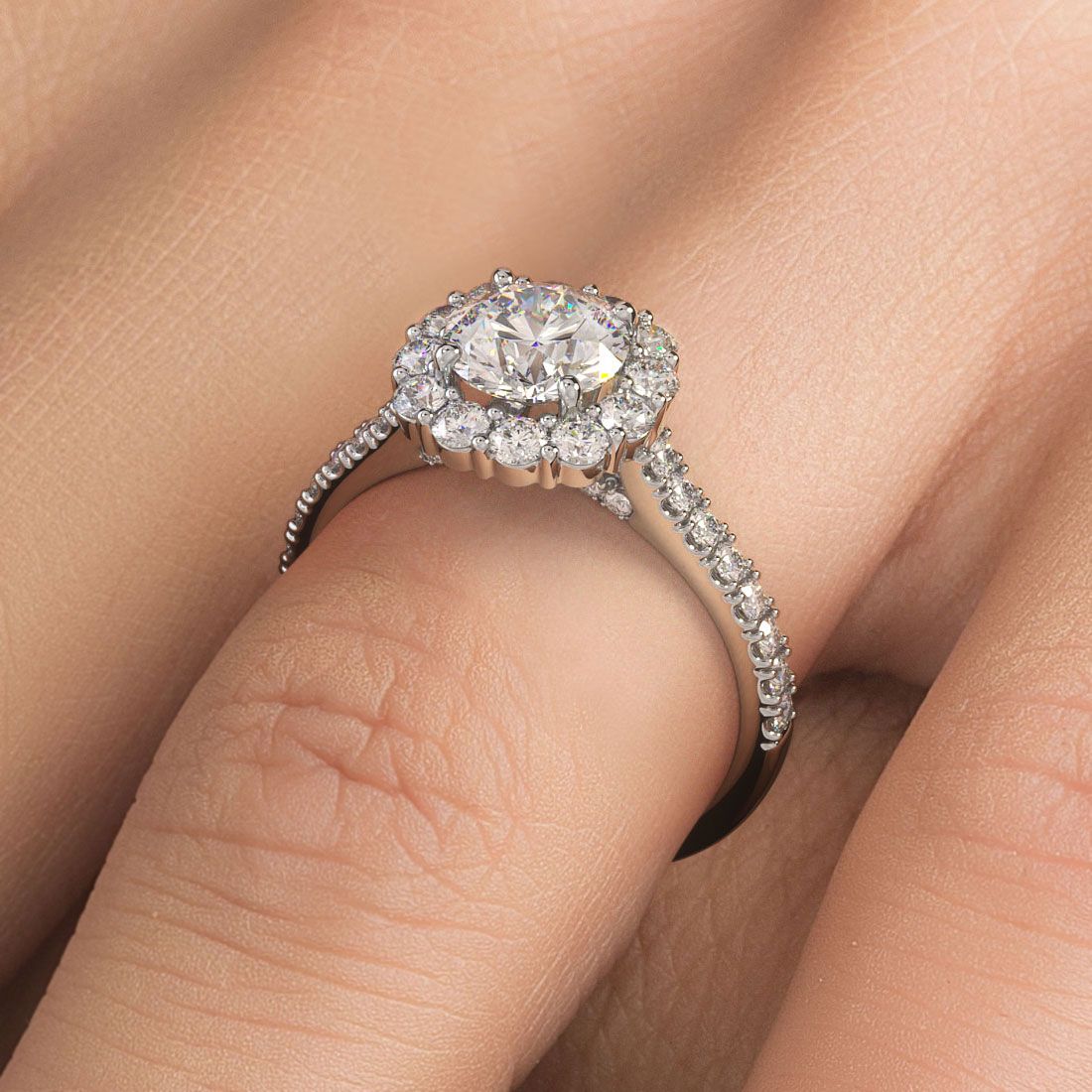 Round halo floral shape engagement ring setting in 18k white gold with 0.80ctw diamonds, shown on hand, designed by Global Sky Diamonds, Diamond District NYC — globalskydiamond.com