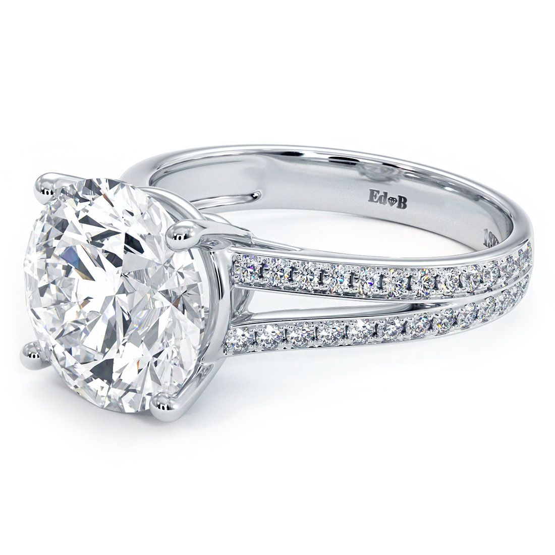 Angled detail shot of handcrafted 18k white gold ring setting with round basket head and split shank covered in micropavé diamonds (0.45ctw), by Global Sky Diamonds, fine jeweler in the Diamond District NYC, 44W 47th St GF-10 — shop globalskydiamond.com