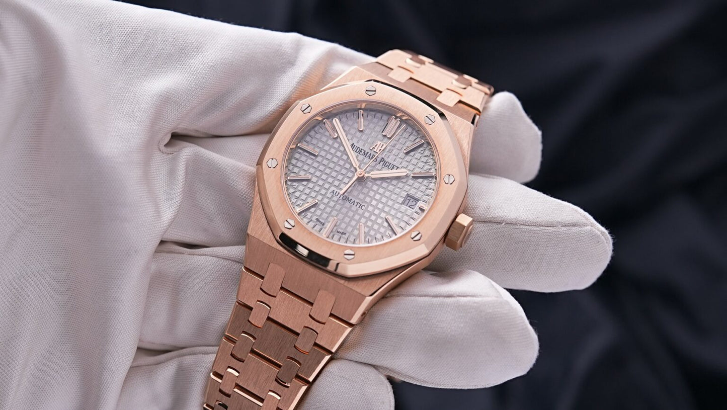 Angled shot of Audemars Piguet Royal Oak 37mm rose gold with nickel grey dial and bracelet – full set brand new watch available at Global Sky Diamonds – globalskydiamond.com