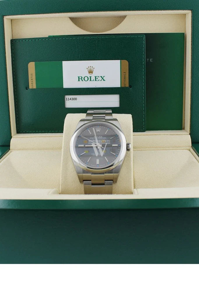 Rolex Oyster Perpetual 39 reference 114300 with smooth bezel, Rhodium gray dial, and Oystersteel bracelet, photographed at Global Sky Diamonds, Diamond District NYC – globalskydiamond.com