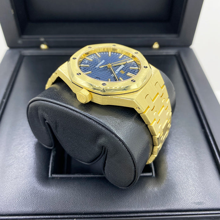 Angled shot of 18k yellow gold Audemars Piguet Royal Oak 15450BA with blue dial and classic bracelet design – full set luxury watch available at Global Sky Diamonds – globalskydiamond.com