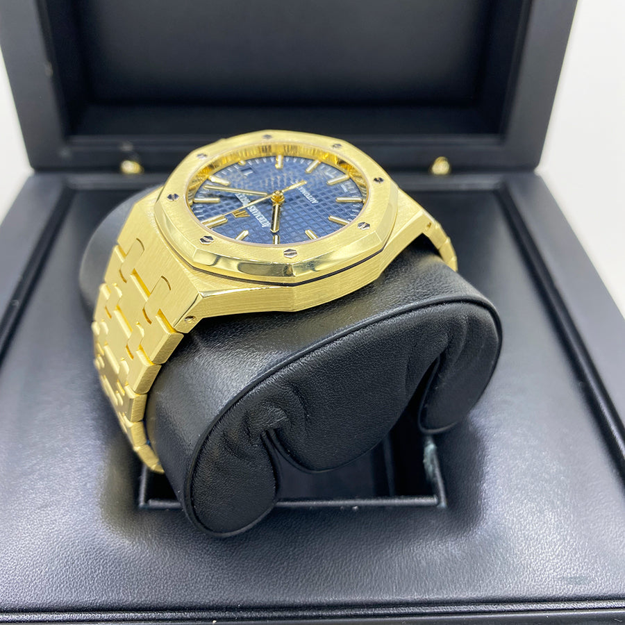 Angled shot of 18k yellow gold Audemars Piguet Royal Oak 15450BA with blue dial and classic bracelet design – full set luxury watch available at Global Sky Diamonds – globalskydiamond.com
