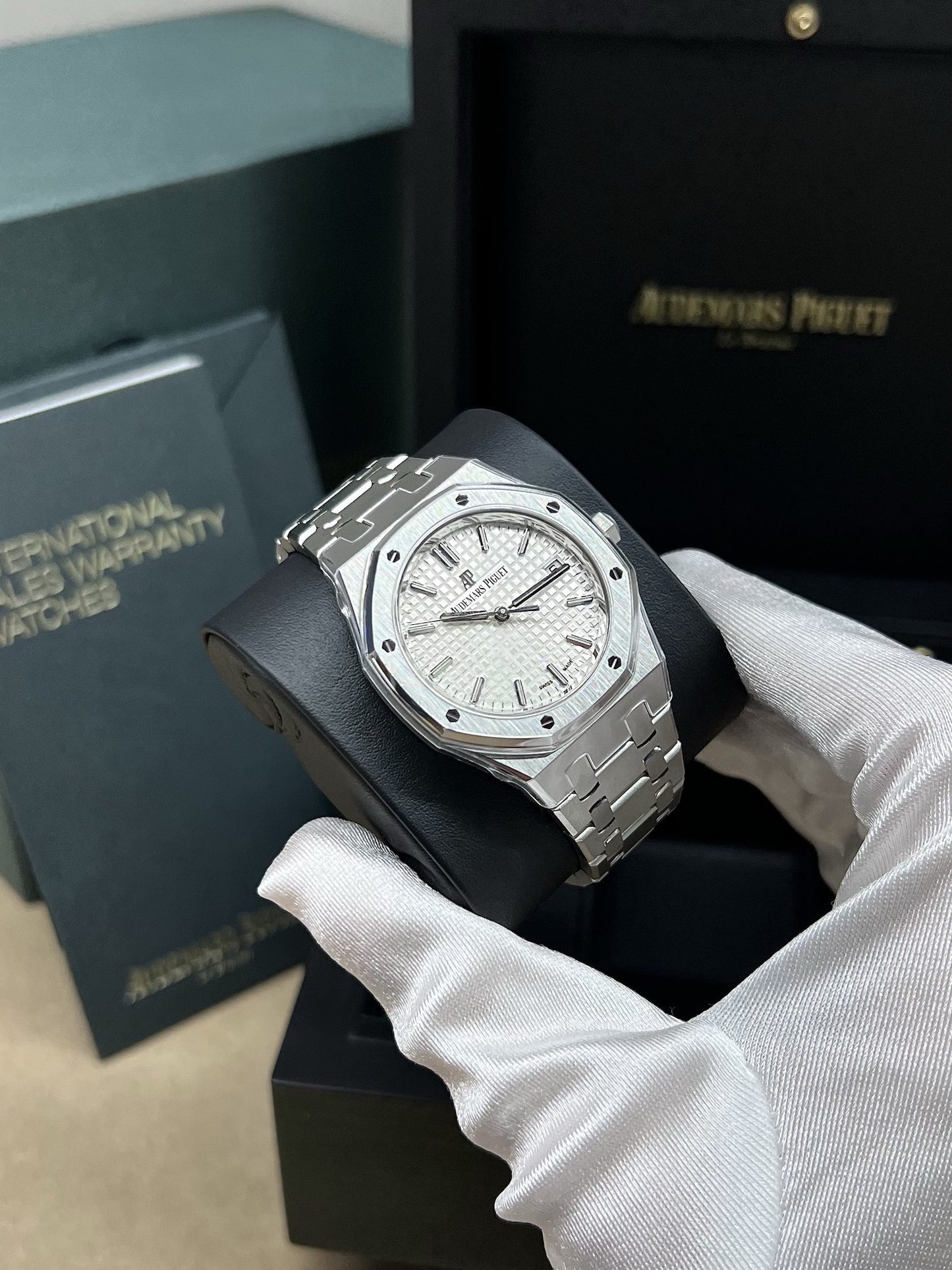 Angled shot of AP Royal Oak 77350ST silver dial luxury watch with integrated steel bracelet – new full set at Global Sky Diamonds – globalskydiamond.com