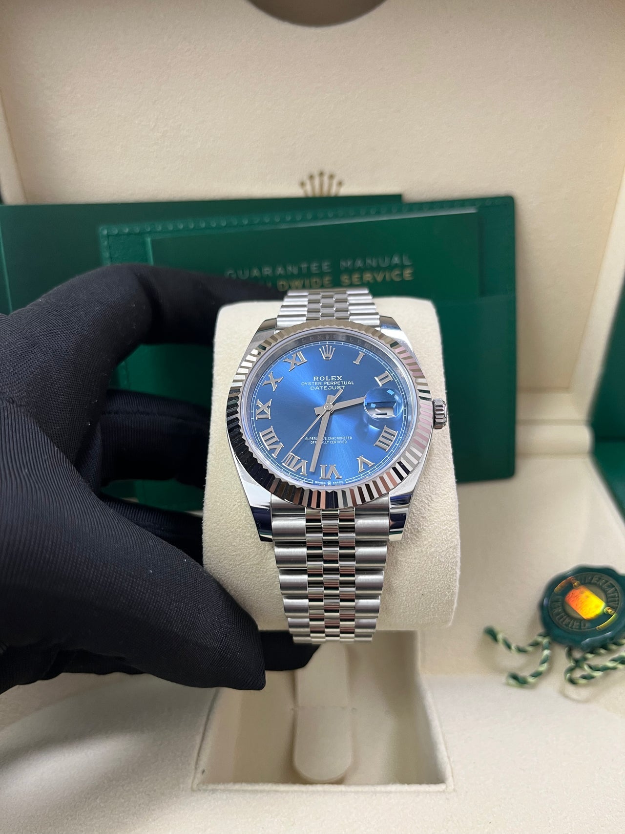 Full set display of Rolex Datejust 126334 with original Rolex box, warranty card, booklet, and Certificate of Authenticity – blue Roman dial pre-owned Rolex 2025 in excellent condition – globalskydiamond.com