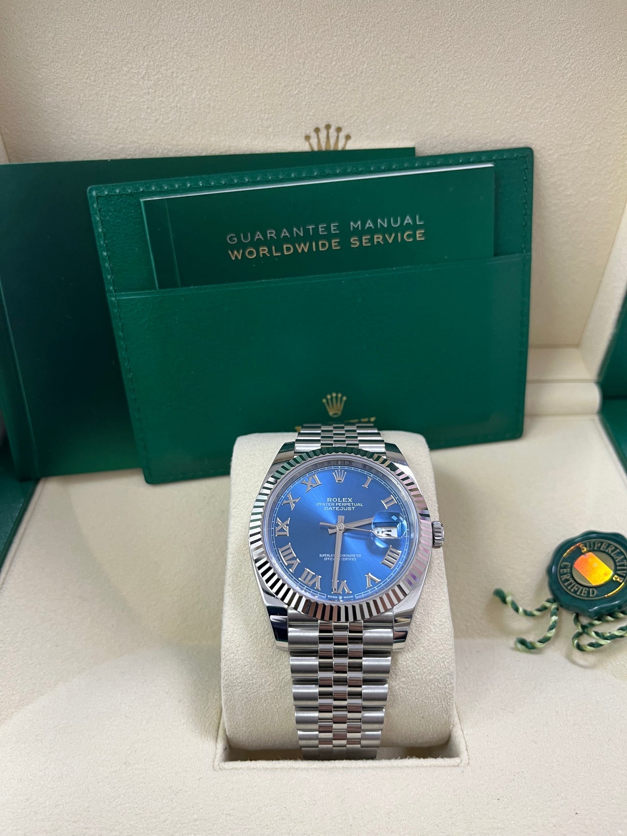 Close-up of Rolex Datejust 41mm blue sunray dial with Roman numeral markers and fluted bezel – pre-owned like-new Rolex model 126334 – available at Global Sky Diamonds – globalskydiamond.com