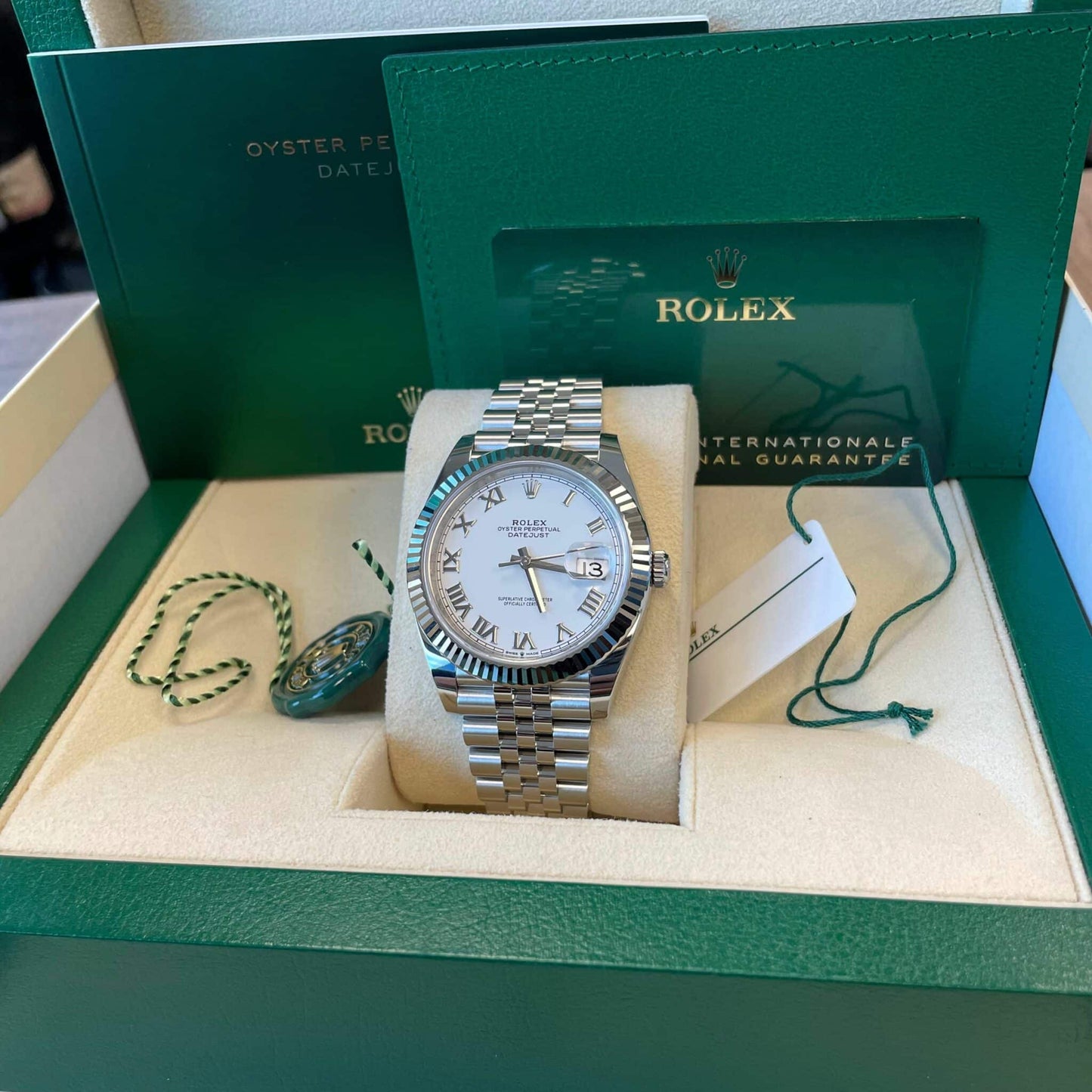 Full set of pre-owned Rolex Datejust 126334 – includes Rolex box, warranty card, booklet, and Certificate of Authenticity – like-new white Roman dial 2025 model available at Global Sky Diamonds – globalskydiamond.com