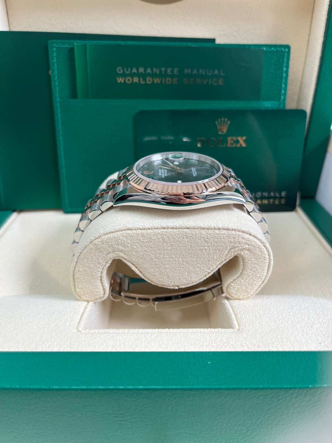 Side profile of Rolex Datejust 126331 with Everose gold fluted bezel, stainless steel case, and Wimbledon dial – pre-owned like-new Rolex from Global Sky Diamonds in NYC Diamond District – globalskydiamond.com