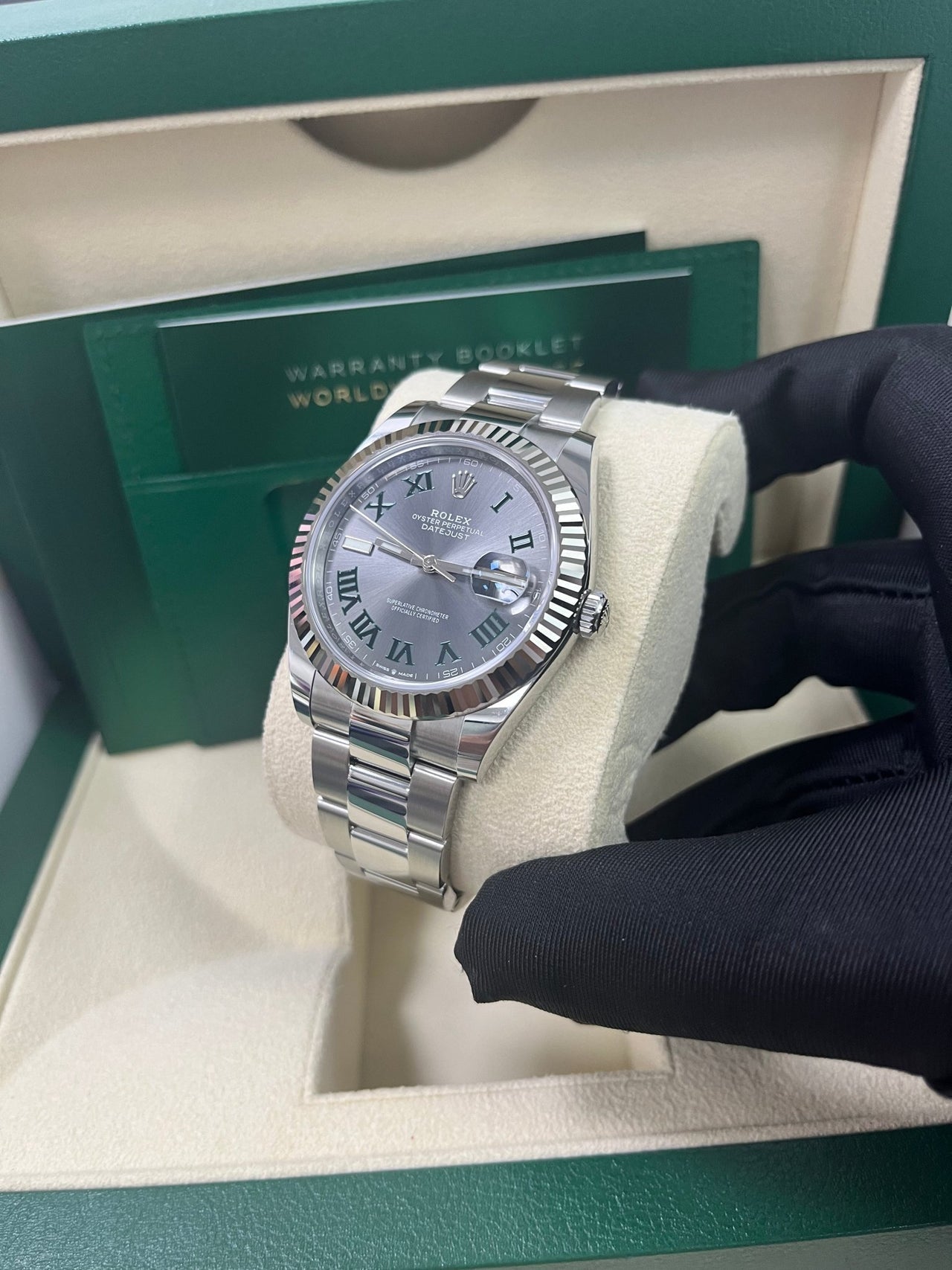 Angled shot of Rolex Datejust 41mm grey dial with Oyster bracelet and Oyster clasp – stainless steel and white gold Rolex 126334 pre-owned like new for $13,000 – Global Sky Diamonds – globalskydiamond.com