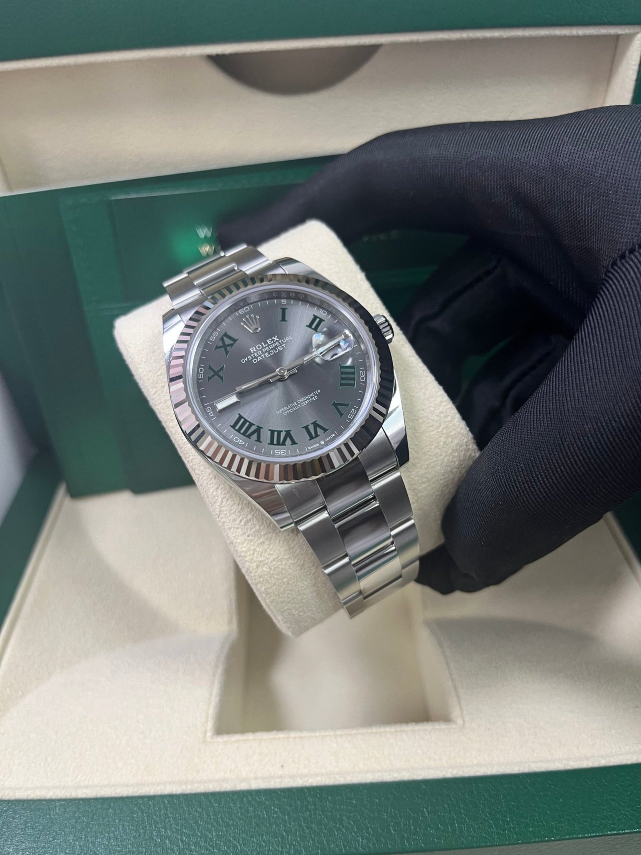 Angled shot of Rolex Datejust 41mm grey dial with Oyster bracelet and Oyster clasp – stainless steel and white gold Rolex 126334 pre-owned like new for $13,000 – Global Sky Diamonds – globalskydiamond.com
