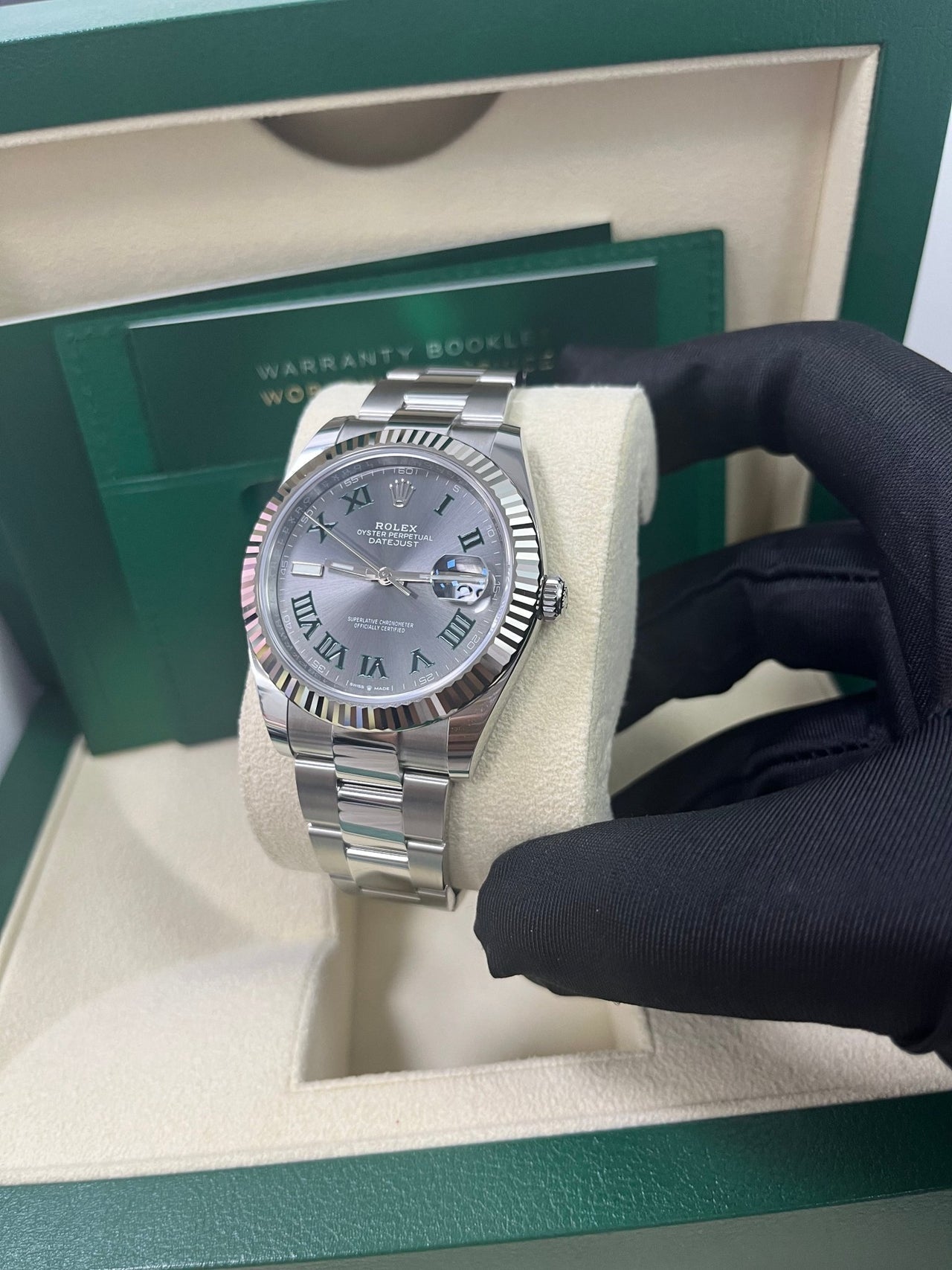 Angled shot of Rolex Datejust 41mm grey dial with Oyster bracelet and Oyster clasp – stainless steel and white gold Rolex 126334 pre-owned like new for $13,000 – Global Sky Diamonds – globalskydiamond.com