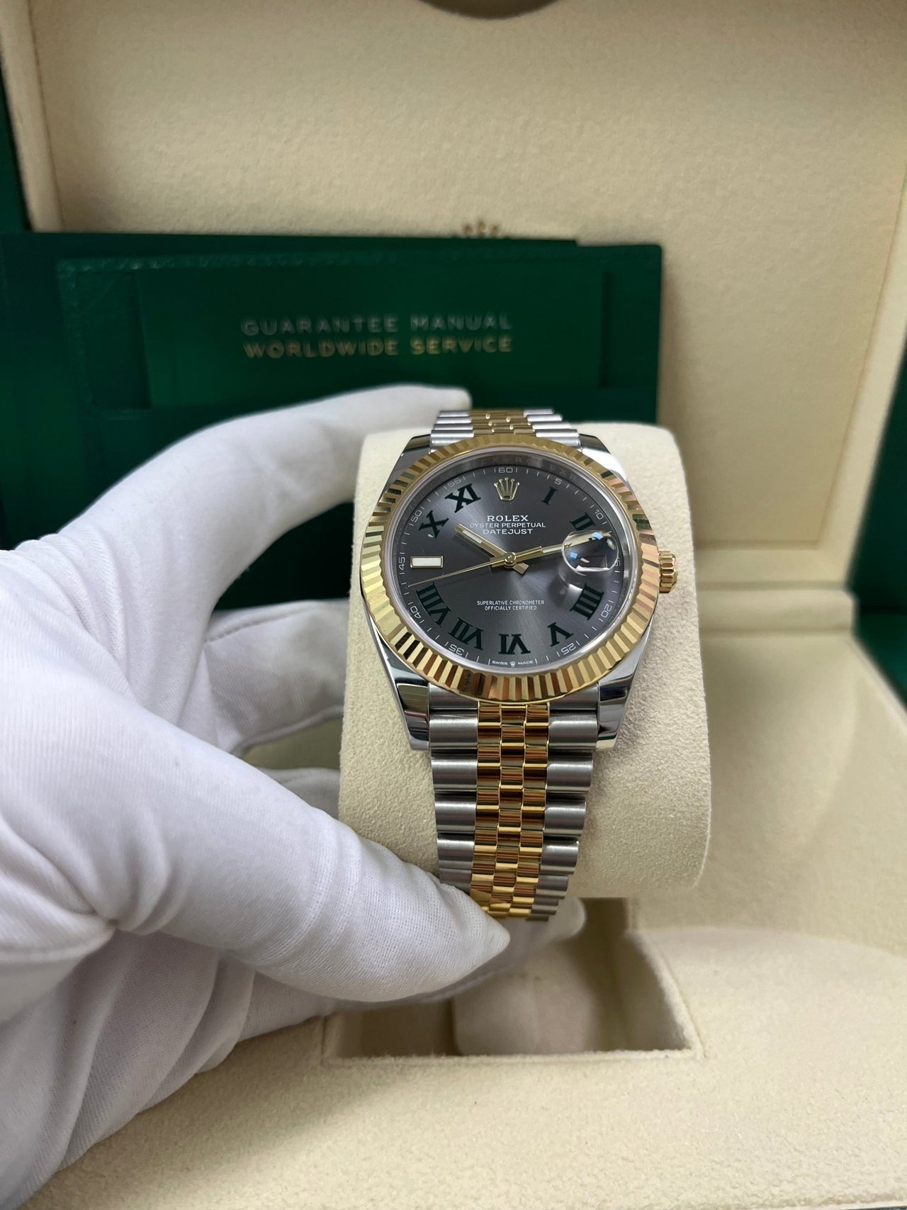 Angled shot of Rolex Datejust 41mm yellow Rolesor model with Jubilee bracelet and Oyster clasp – grey dial Rolex 126333 pre-owned like-new for $15,500 from Global Sky Diamonds – globalskydiamond.com