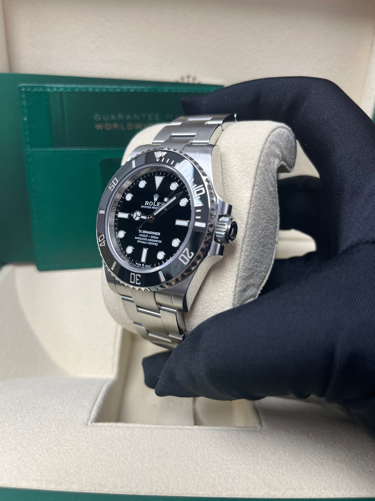 Angled shot of Rolex Submariner 124060 with black Cerachrom bezel, clean no-date black dial, and steel bracelet – pre-owned Rolex 2025 watch from Global Sky Diamonds – globalskydiamond.com
