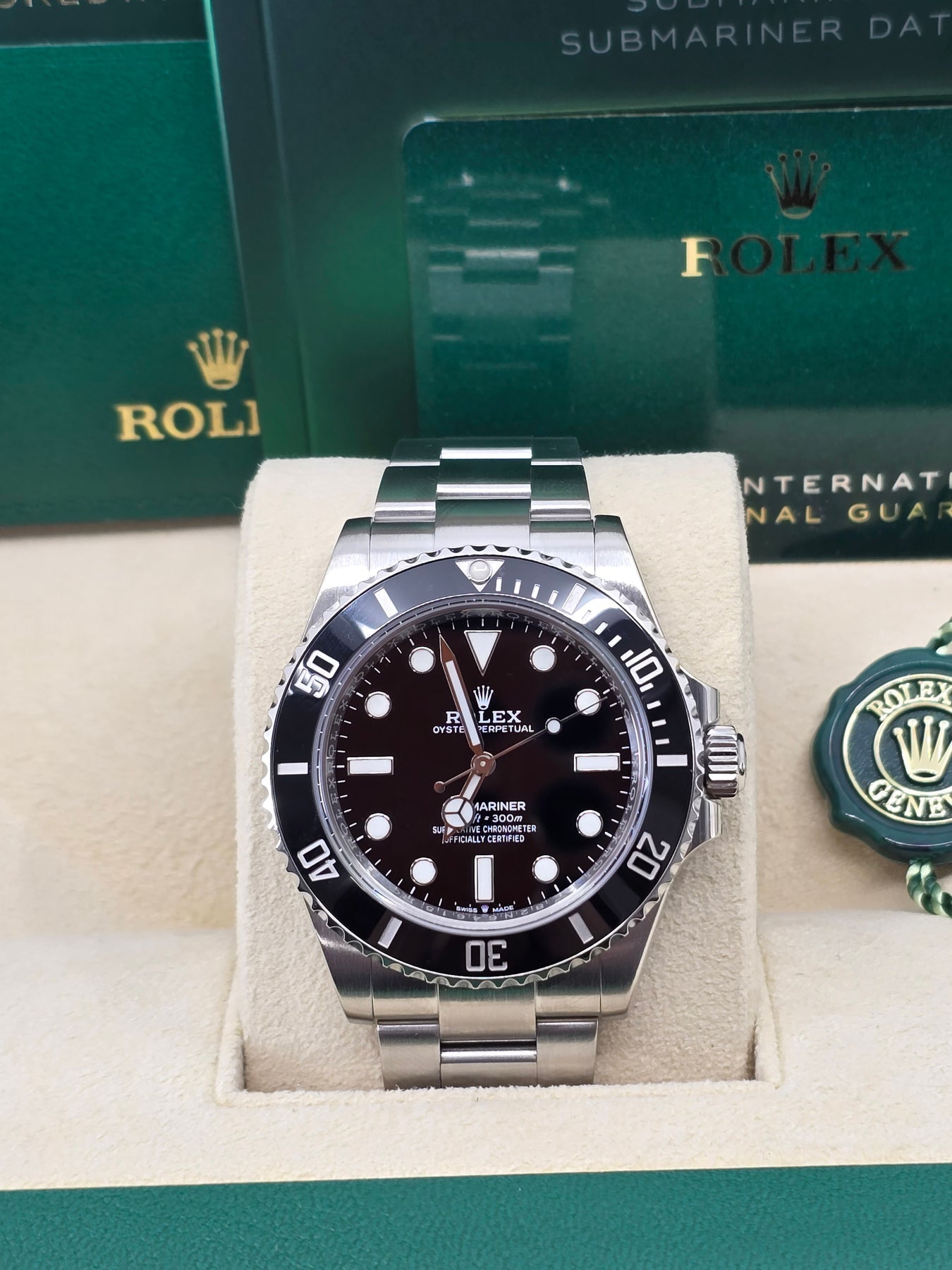 Close-up of Rolex Submariner 114060 black dial with Chromalight markers and Mercedes hands – pre-owned 2018 Rolex No Date Submariner in like-new condition – globalskydiamond.com