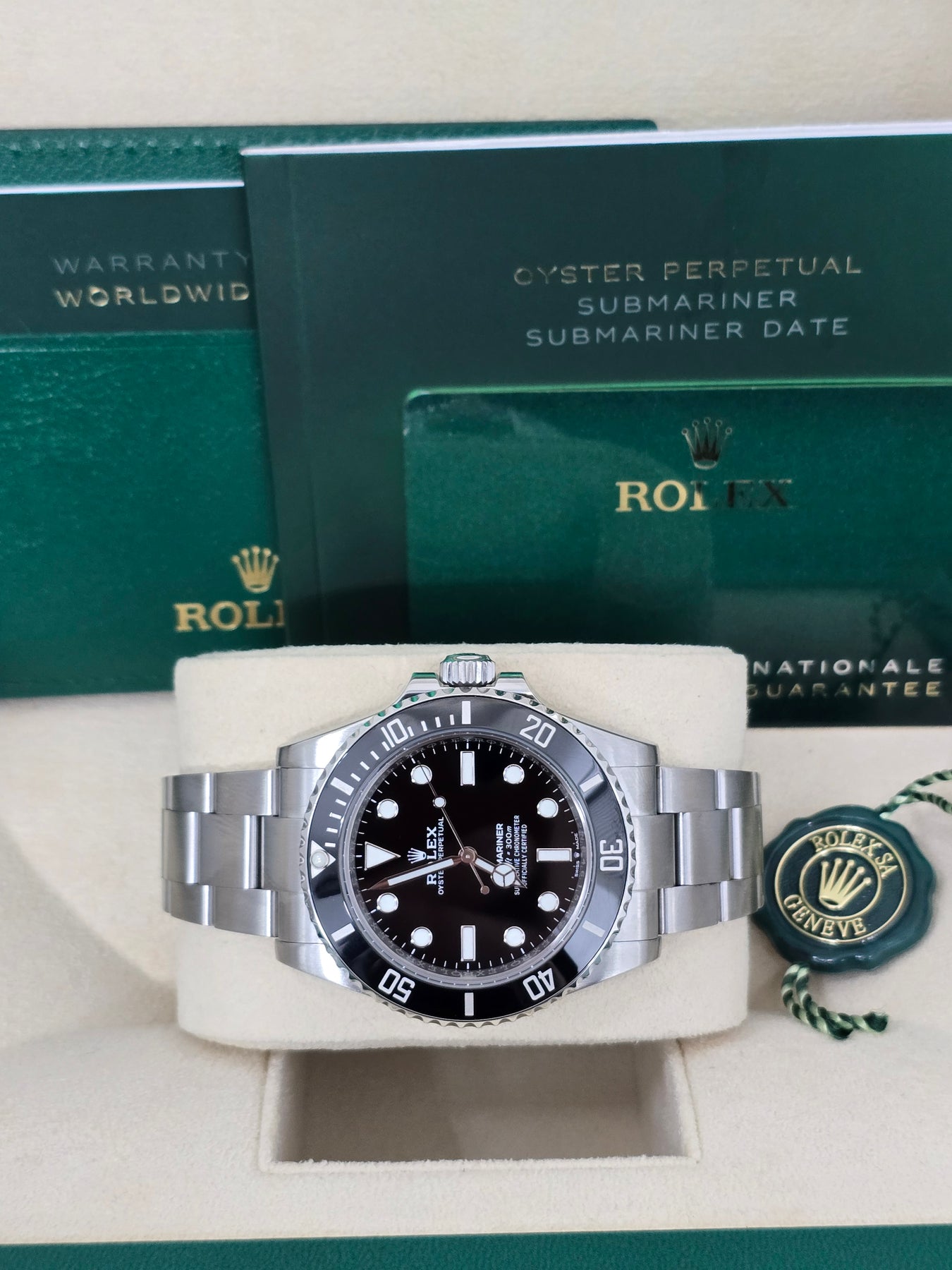 Side profile of Rolex 114060 Submariner showing stainless steel case, no-date dial, and Glidelock clasp – full set with box and appraisal papers at Global Sky Diamonds – globalskydiamond.com