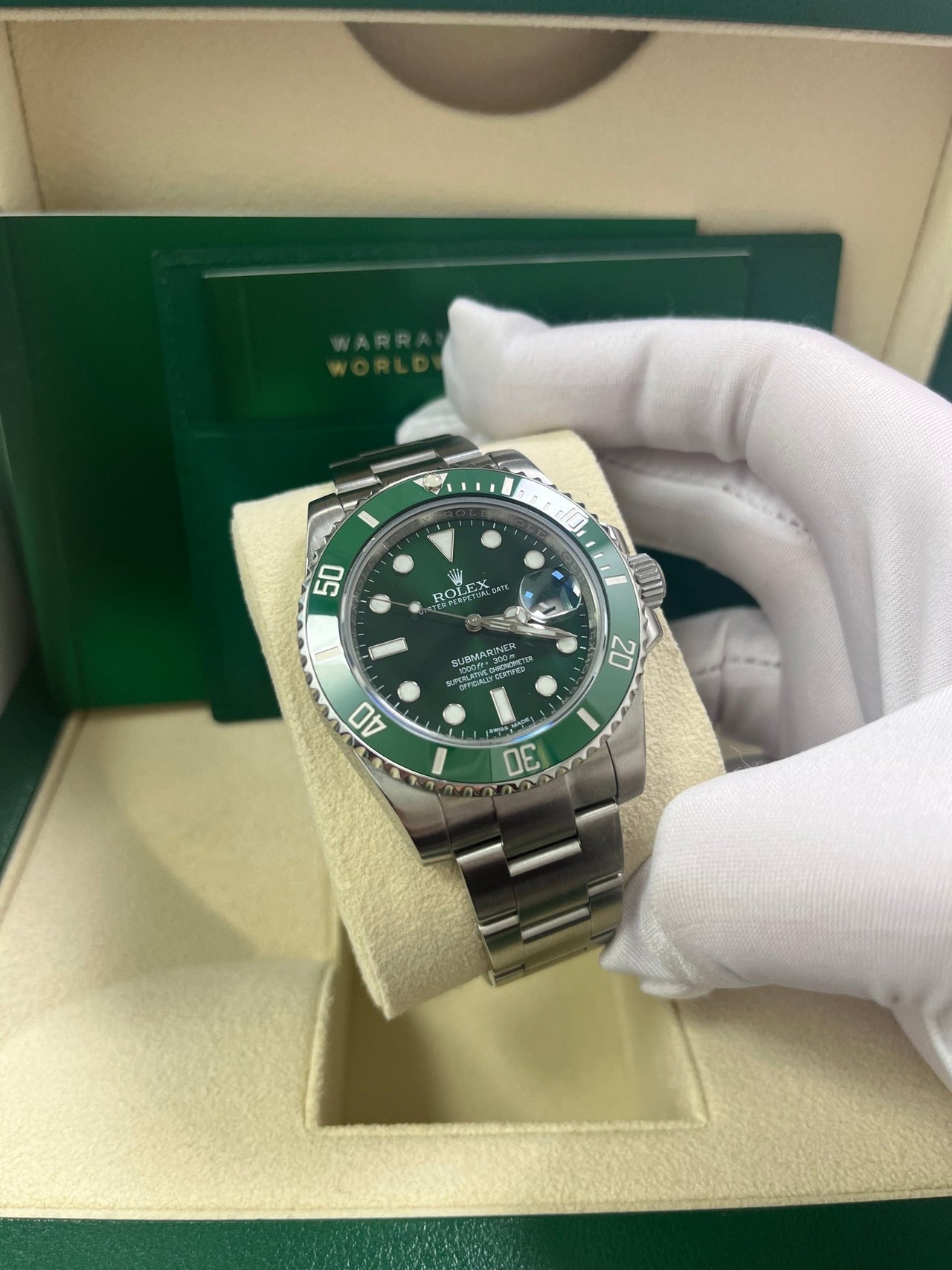 Angled shot of Rolex Submariner 40mm Hulk model 116610LV with stainless steel case, Glidelock clasp, and green dial – pre-owned 2018 full set for $18,500 at Global Sky Diamonds – globalskydiamond.com