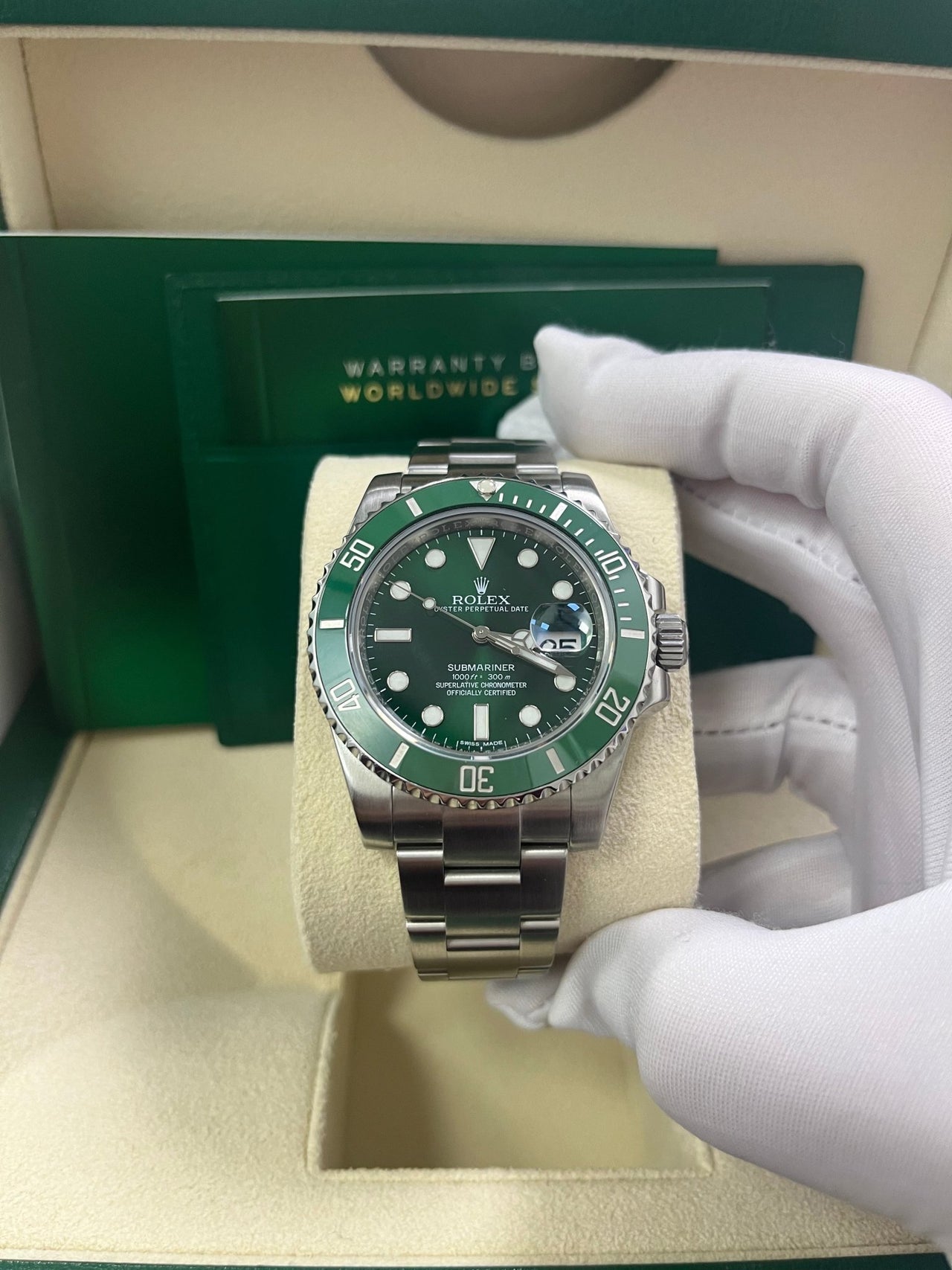 Close-up of Rolex Submariner Hulk green dial and bezel with Chromalight lume and Cyclops date – 116610LV in like-new 2018 condition with box and papers – globalskydiamond.com