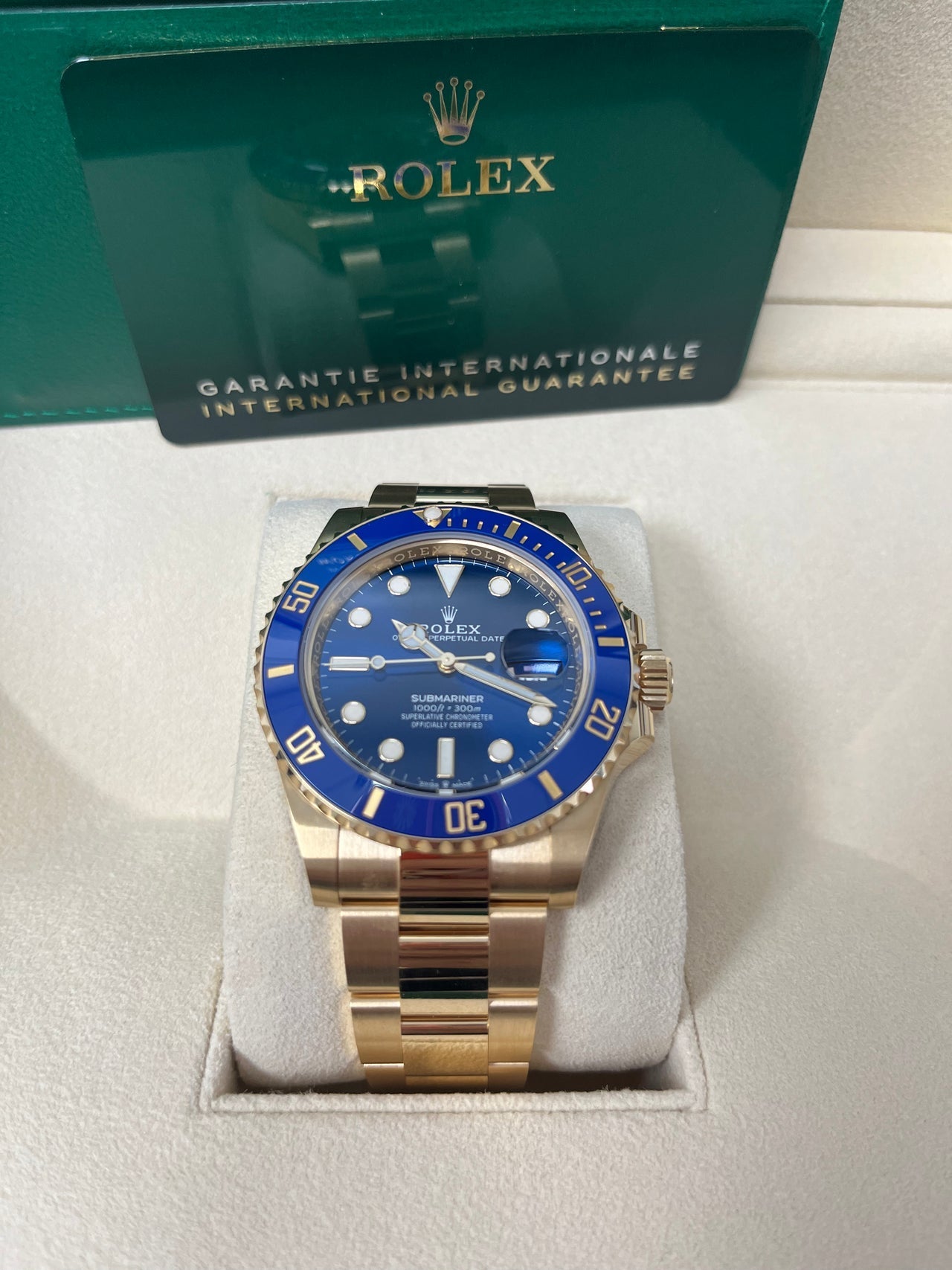 Angled shot of Rolex Submariner Date 41mm Bluesy showing two-tone case and bracelet, blue bezel, and Triplock crown – unworn pre-owned 2025 Rolex for $18,000 – globalskydiamond.com