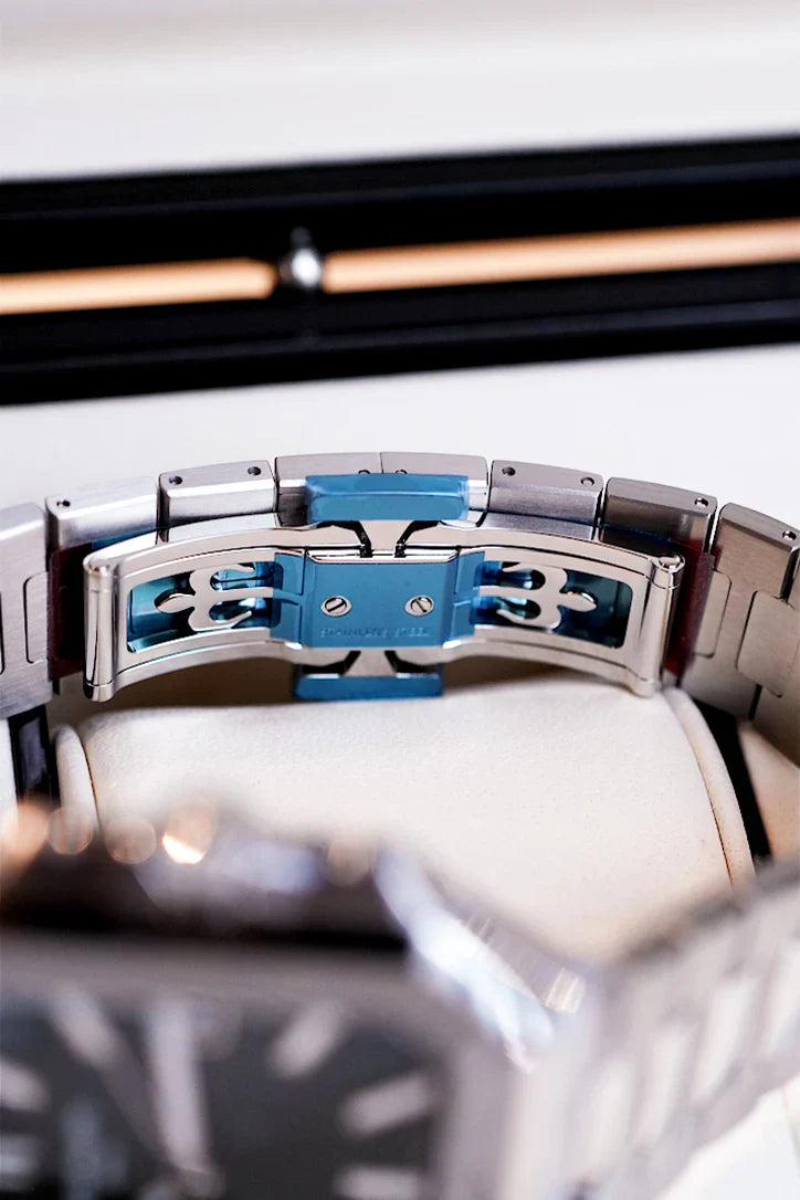 Brushed stainless steel bracelet and olive green dial of Patek Philippe Cubitus 5821/1A shown under natural light – Global Sky Diamonds NYC | GlobalSkyDiamond.com